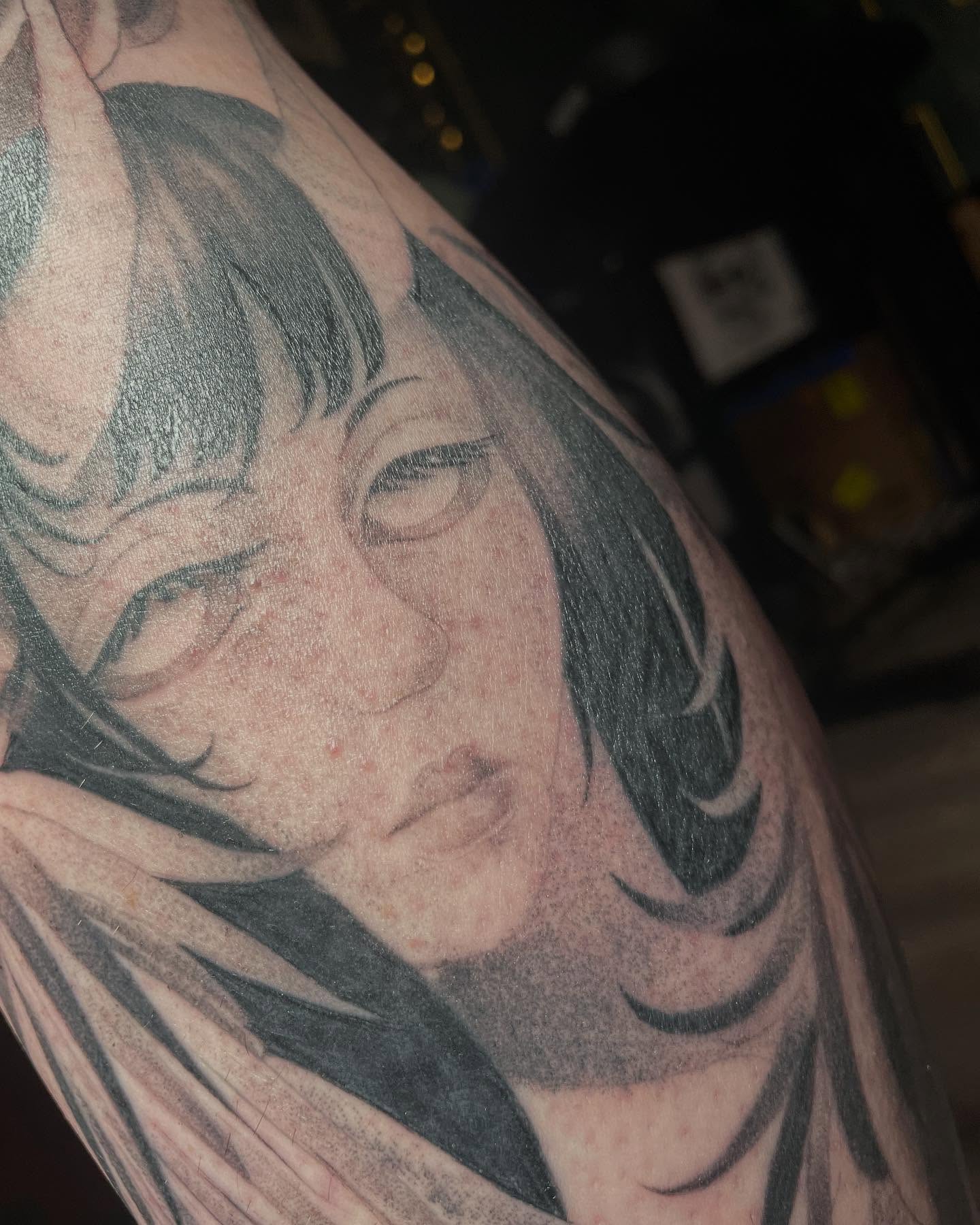 Portrait realism tattoo on the upper arm by Tayler Beetison