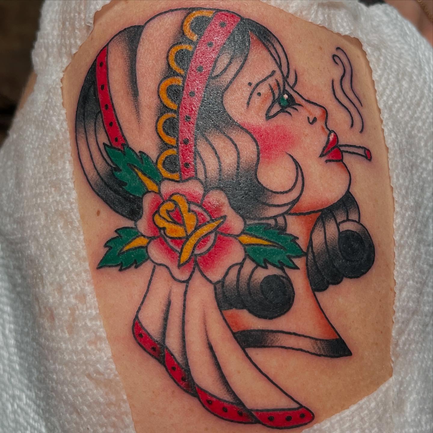 Woman smoking American traditional tattoo on the upper arm by ✮KAT✮