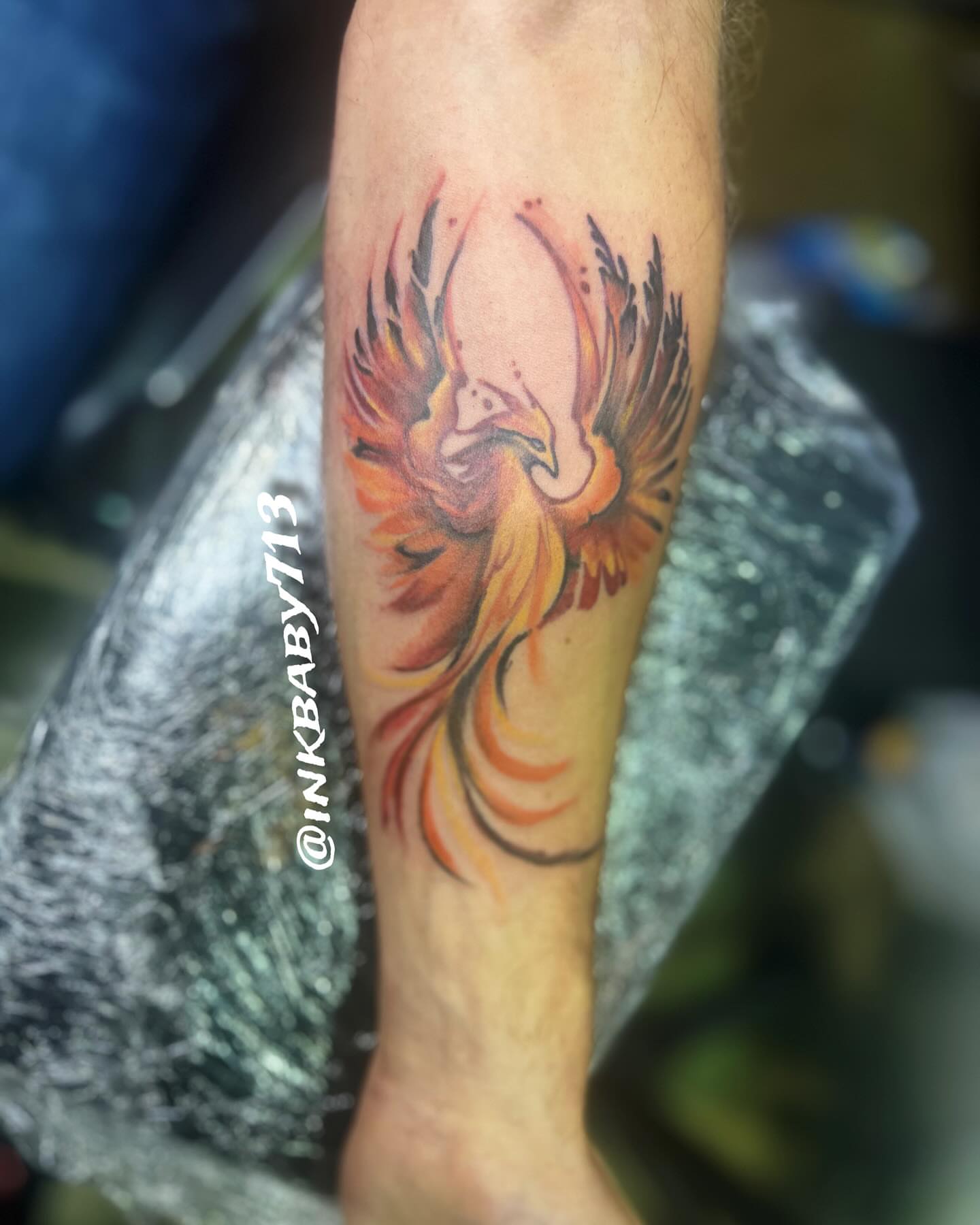 Flaming phoenix new school tattoo on the forearm by Ayanna Luna