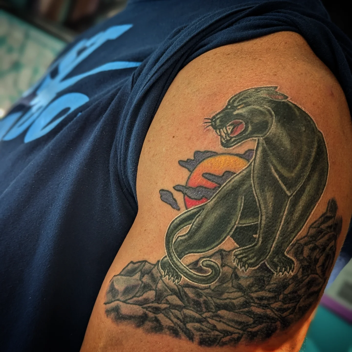 Panther black and grey tattoo on the shoulder by Lorelei