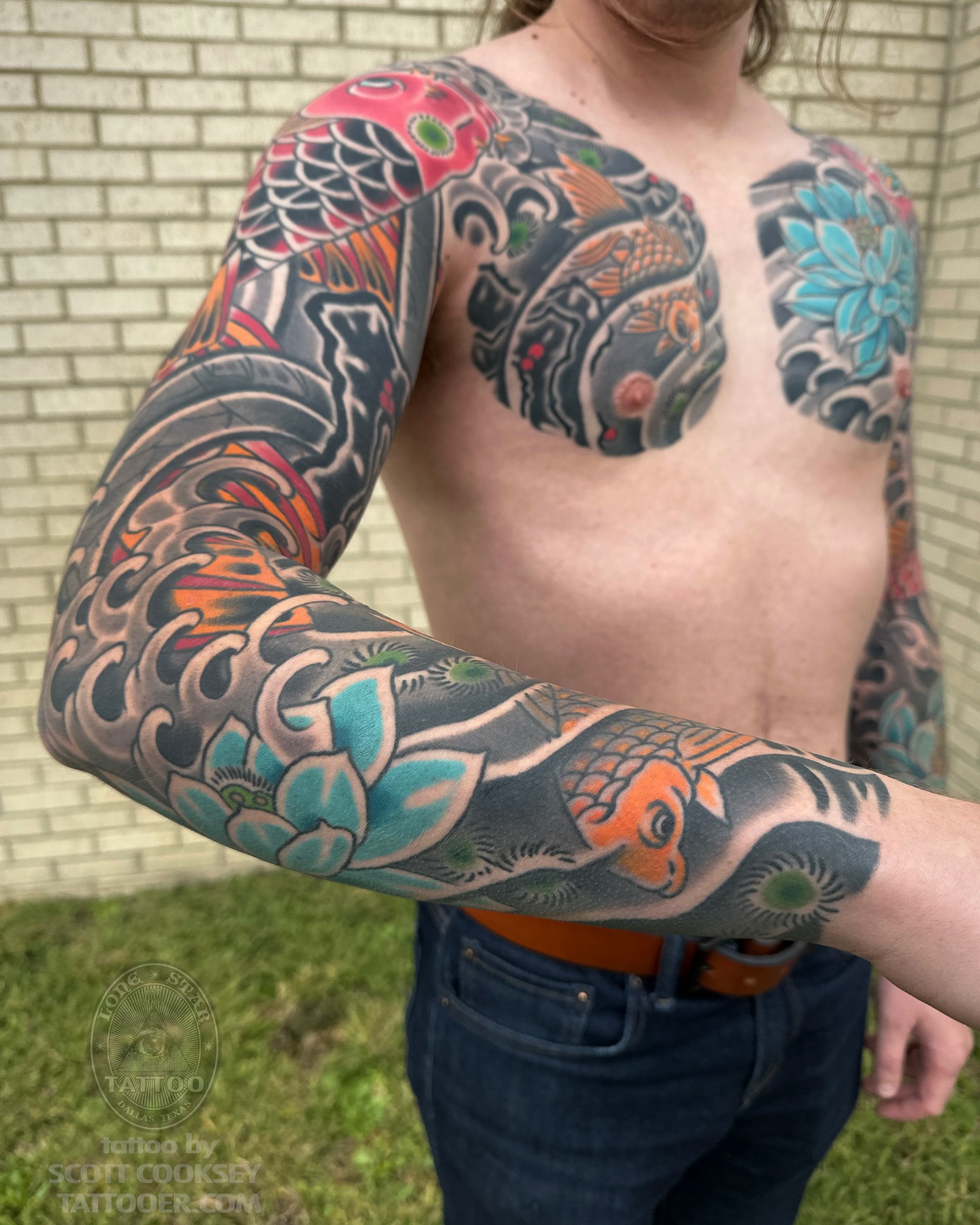 Koi fish and floral patterns japanese irezumi tattoo on the upper arm by Scott Allen Cooksey, Plano, Texas