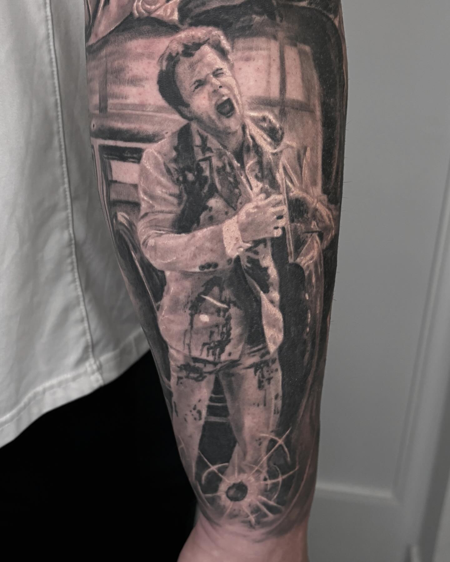 Man in suit realism tattoo on the forearm by Rusty Dornhecker, Columbus, Ohio