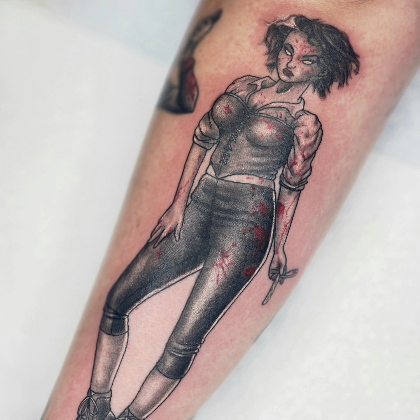 Female figure realism tattoo on the forearm by Zach Mullins