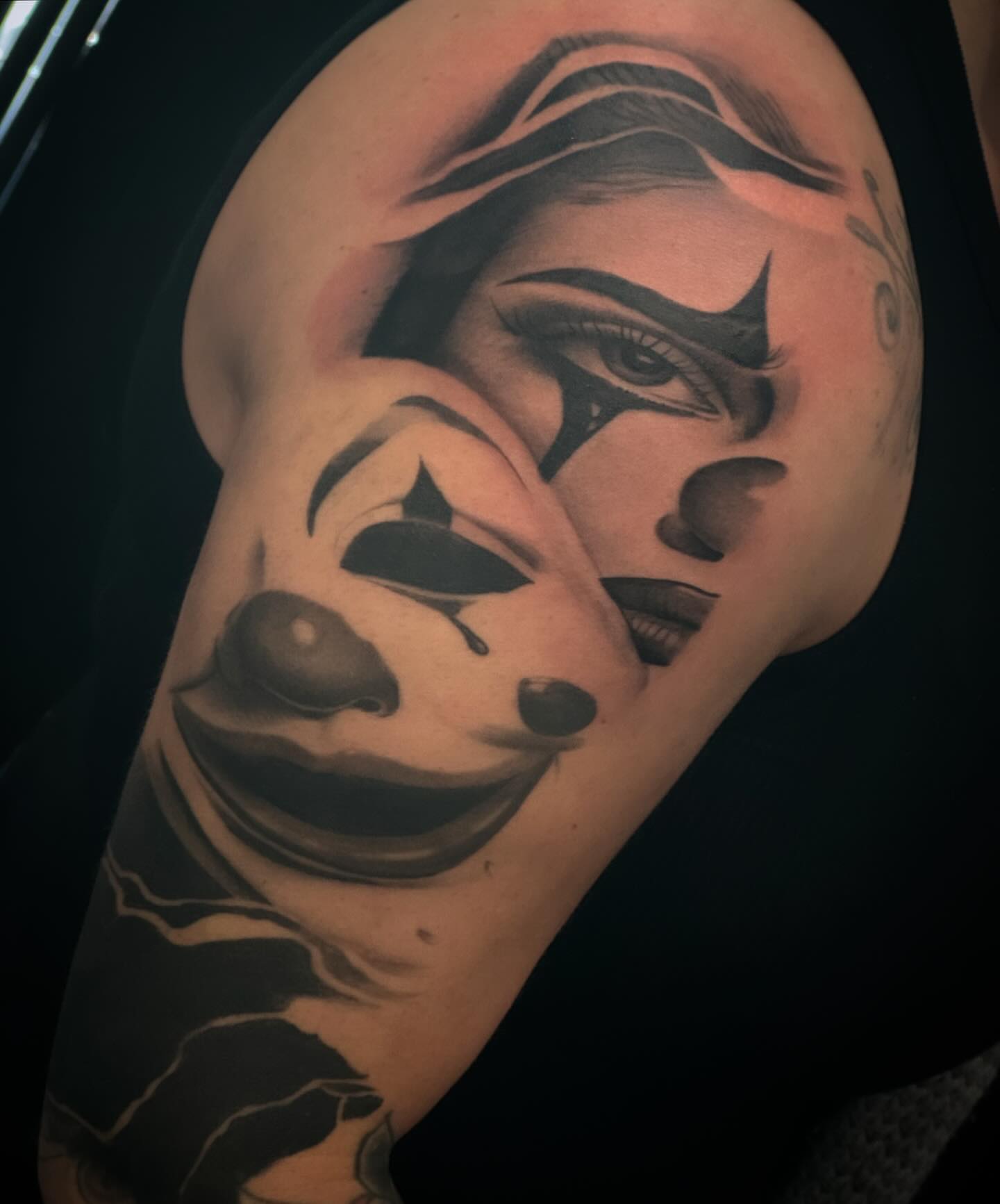 Clown face realism tattoo on the shoulder by Bernie calderon, Fresno, California