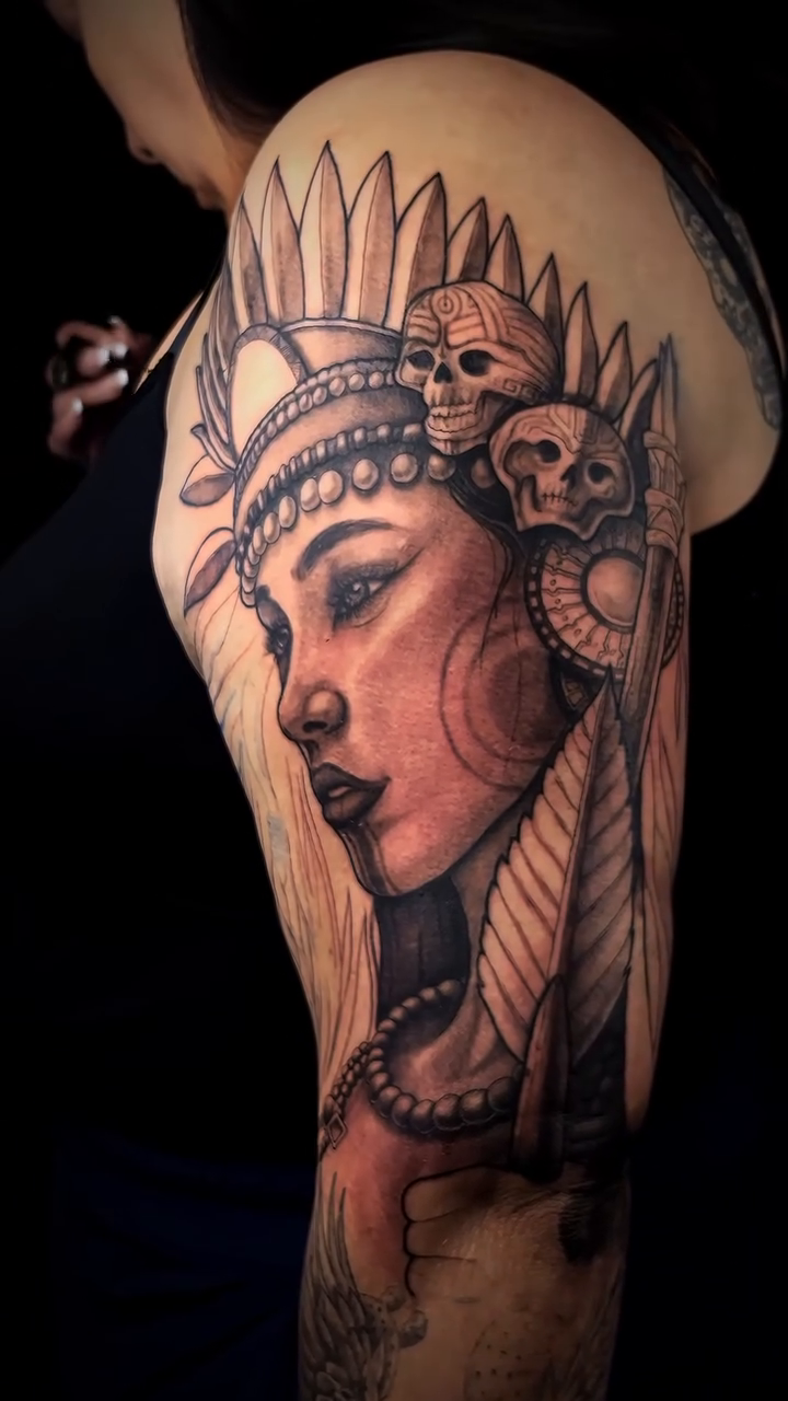 Native American woman with headdress realism tattoo by Denver Tattoo Artist