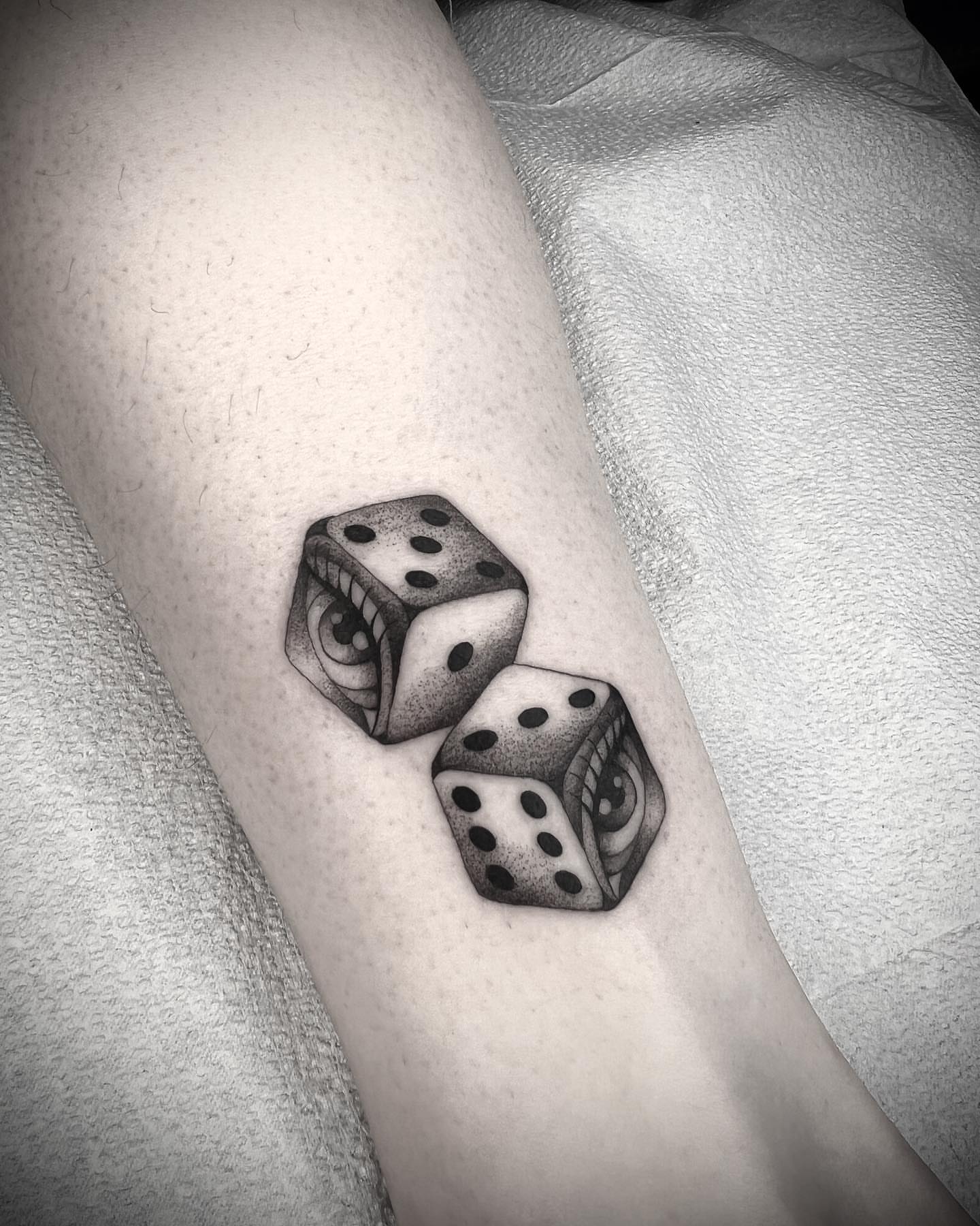 Dice dotwork tattoo on the forearm by linahsiaotattoo