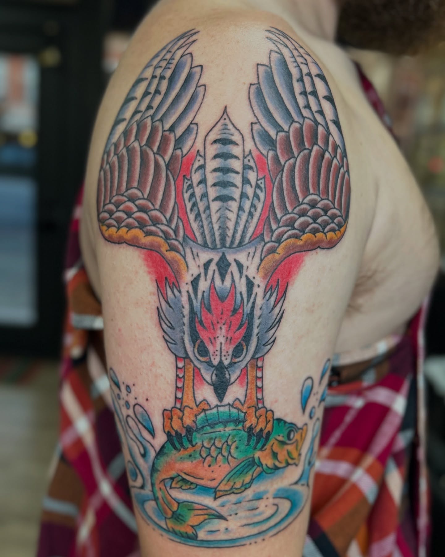 Bird and fish American traditional tattoo on the shoulder by Alex Fannin