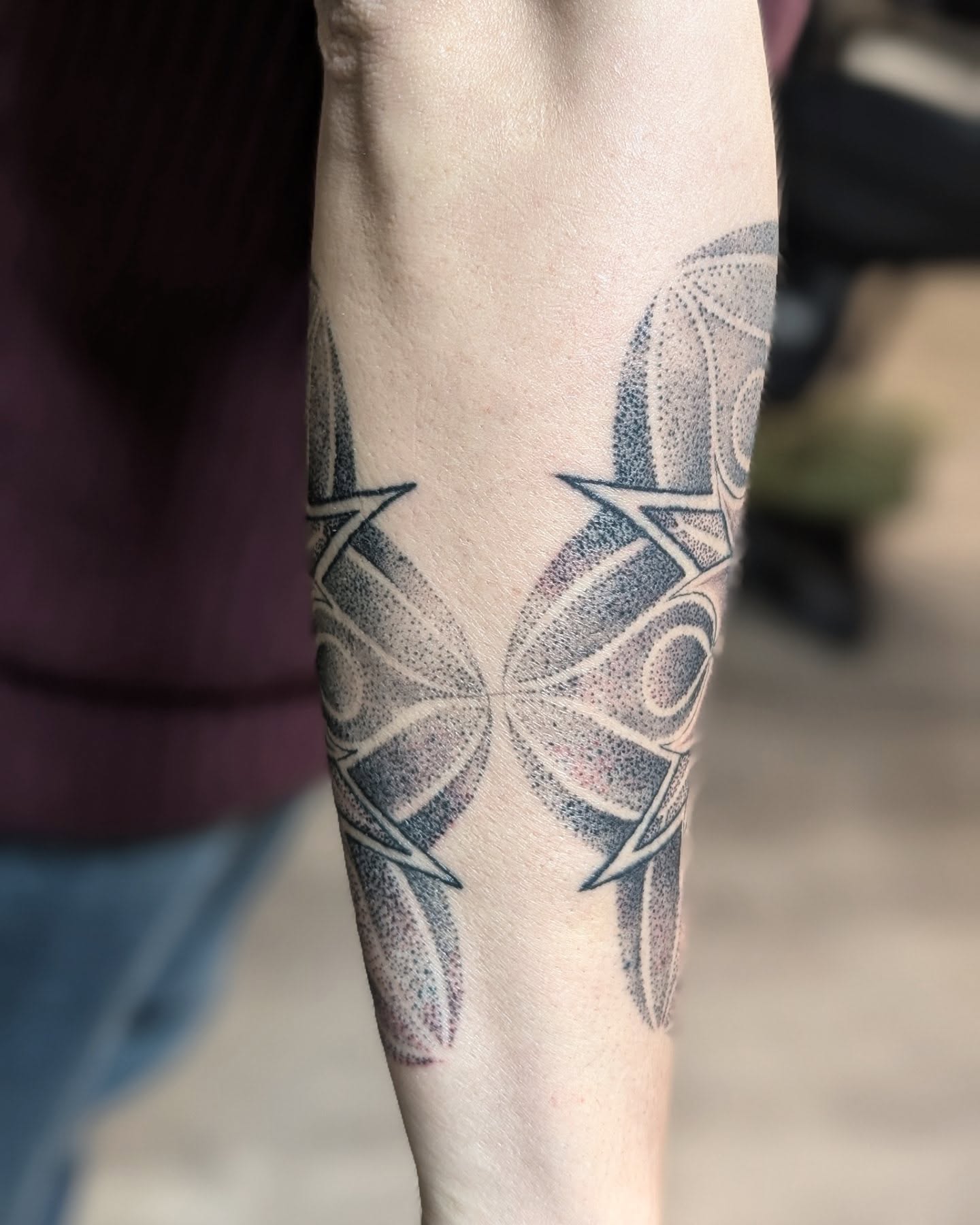Geometric butterfly dotwork tattoo on the forearm by Ashton Allen-Ruiz, Portland, Oregon