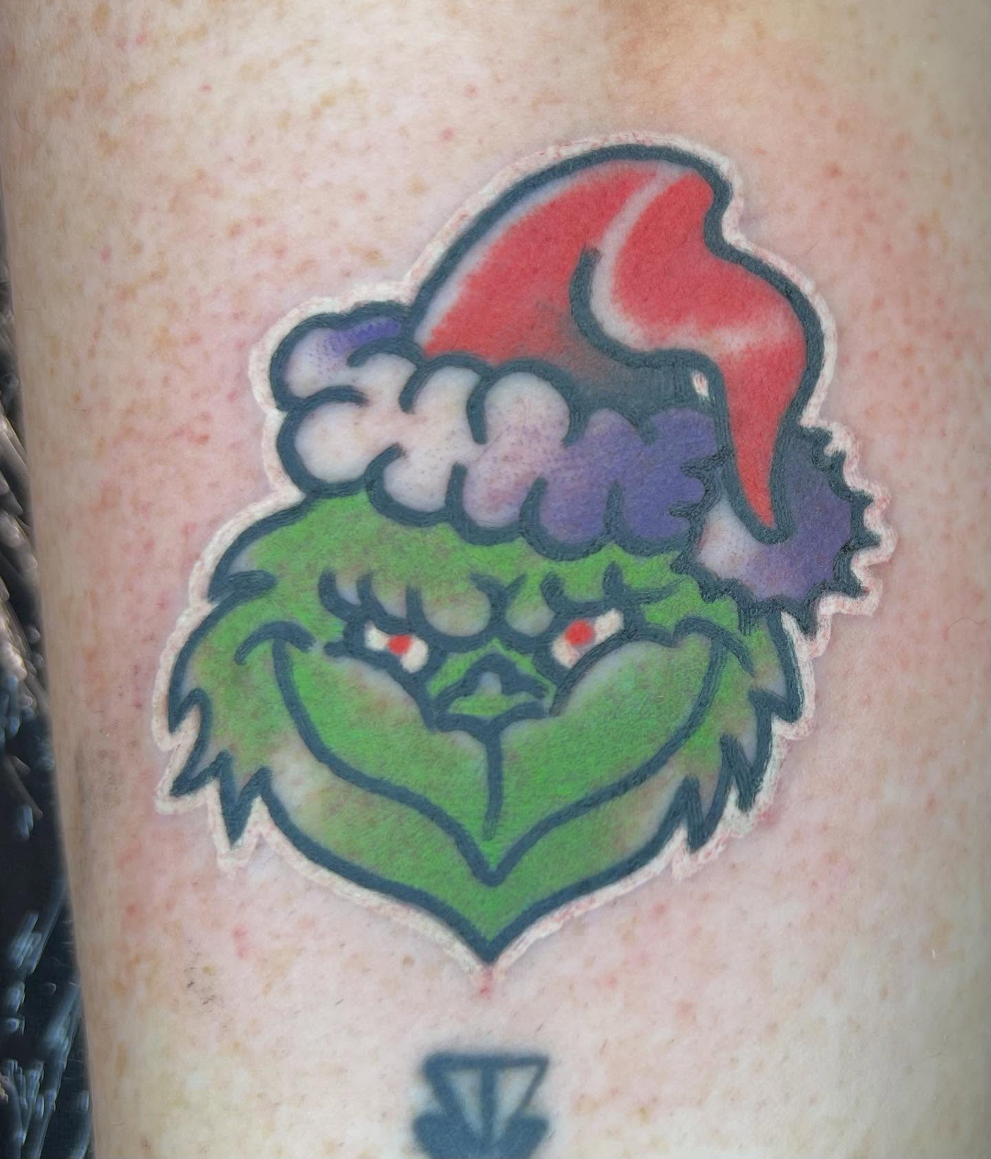 The grinch dotwork tattoo on the forearm by Will Eagle