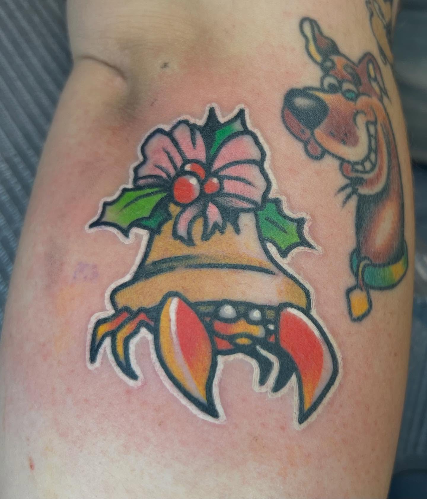Christmas bell crab scooby-doo American traditional tattoo on the thigh by Will Eagle