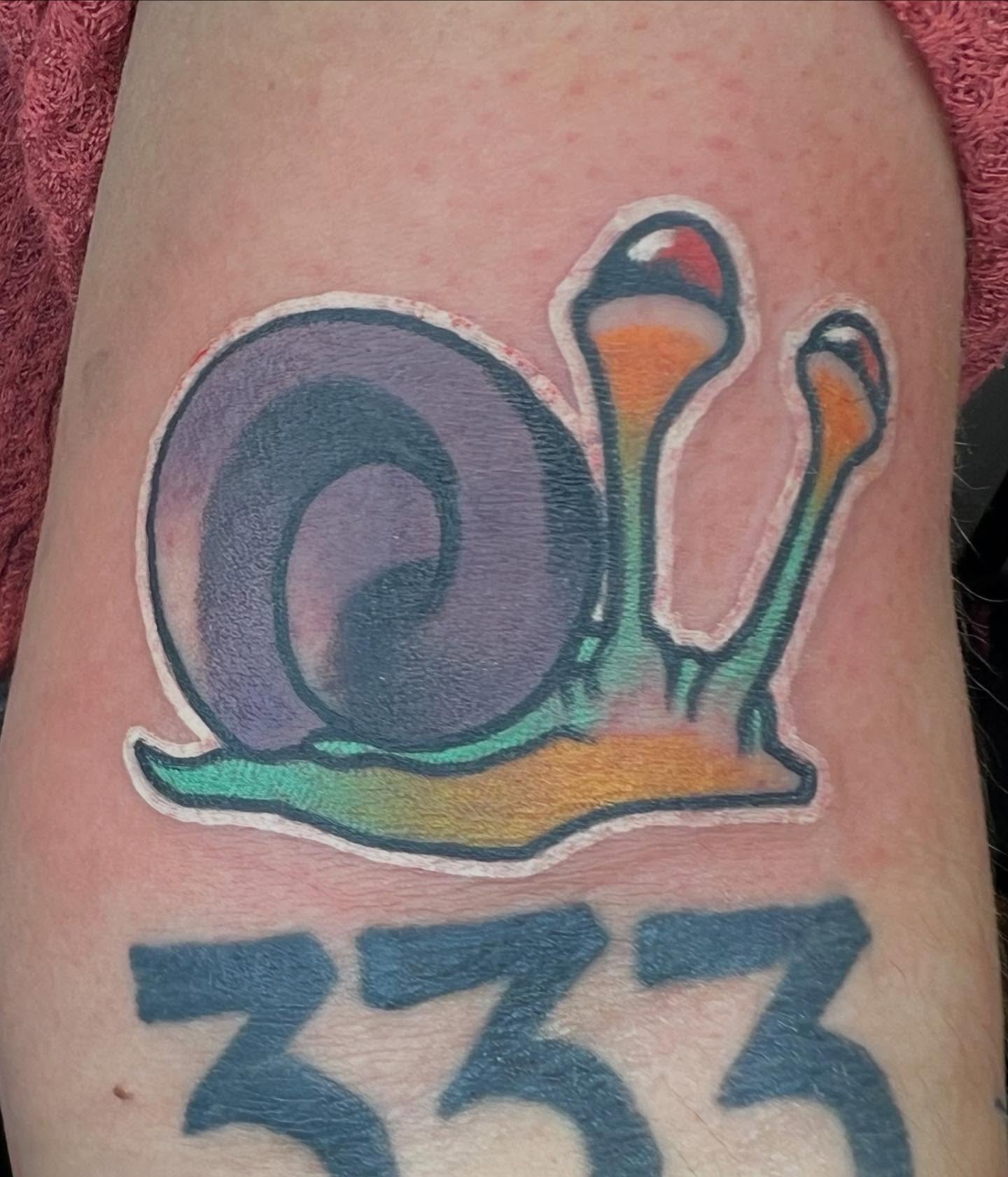 Snail new school tattoo on the thigh by Will Eagle