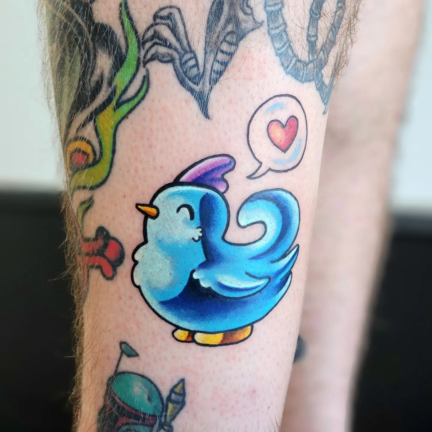 Blue bird American traditional tattoo on the forearm by Elizabeth Stepp