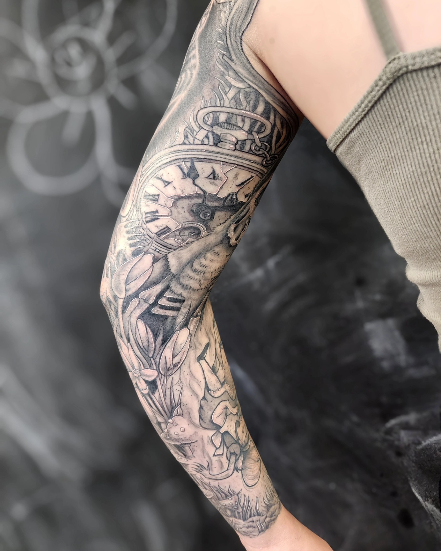 Mechanical and floral design geometric tattoo on the forearm by Bry True