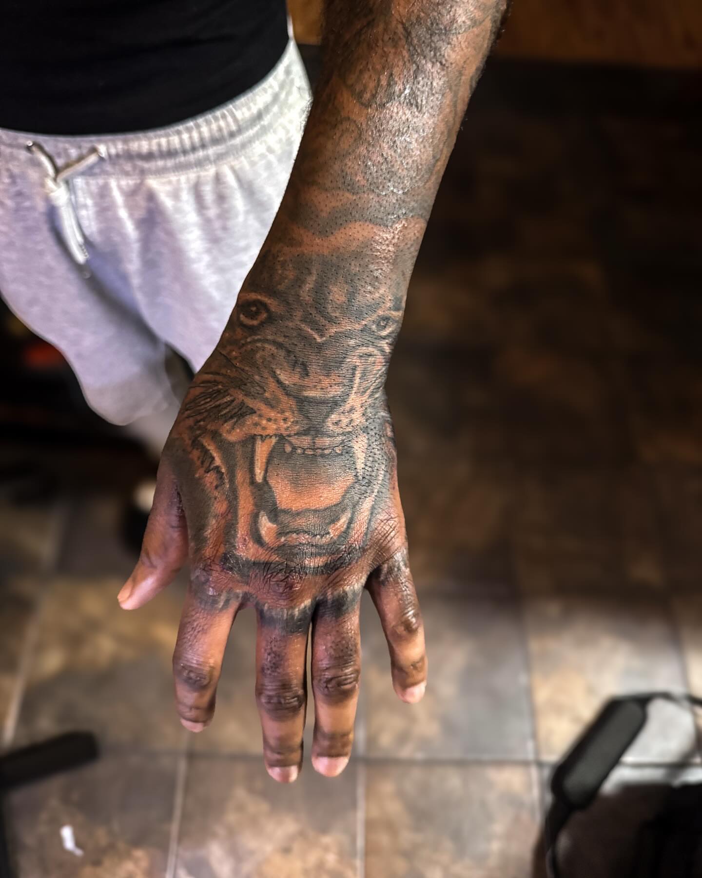 Lion American traditional tattoo on the hand by dallas tattoo artist, Duncanville, Texas
