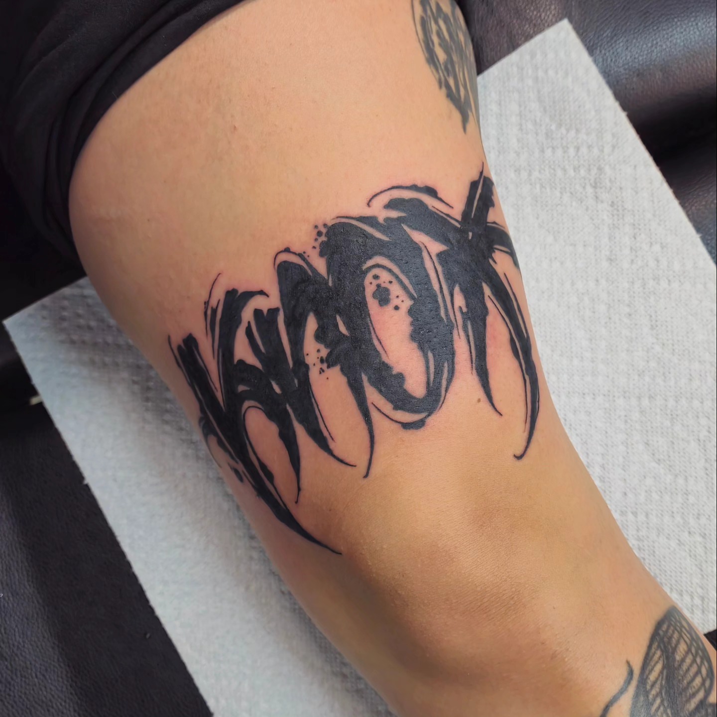 Abstract design black and grey tattoo on the thigh by DiazTattoos, Denver, Colorado