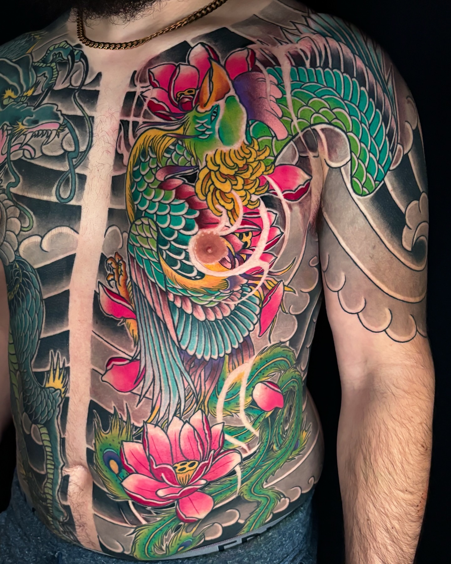 Koi fish and lotus flowers japanese irezumi tattoo on the torso by Matt Trimble, Charlotte, North Carolina