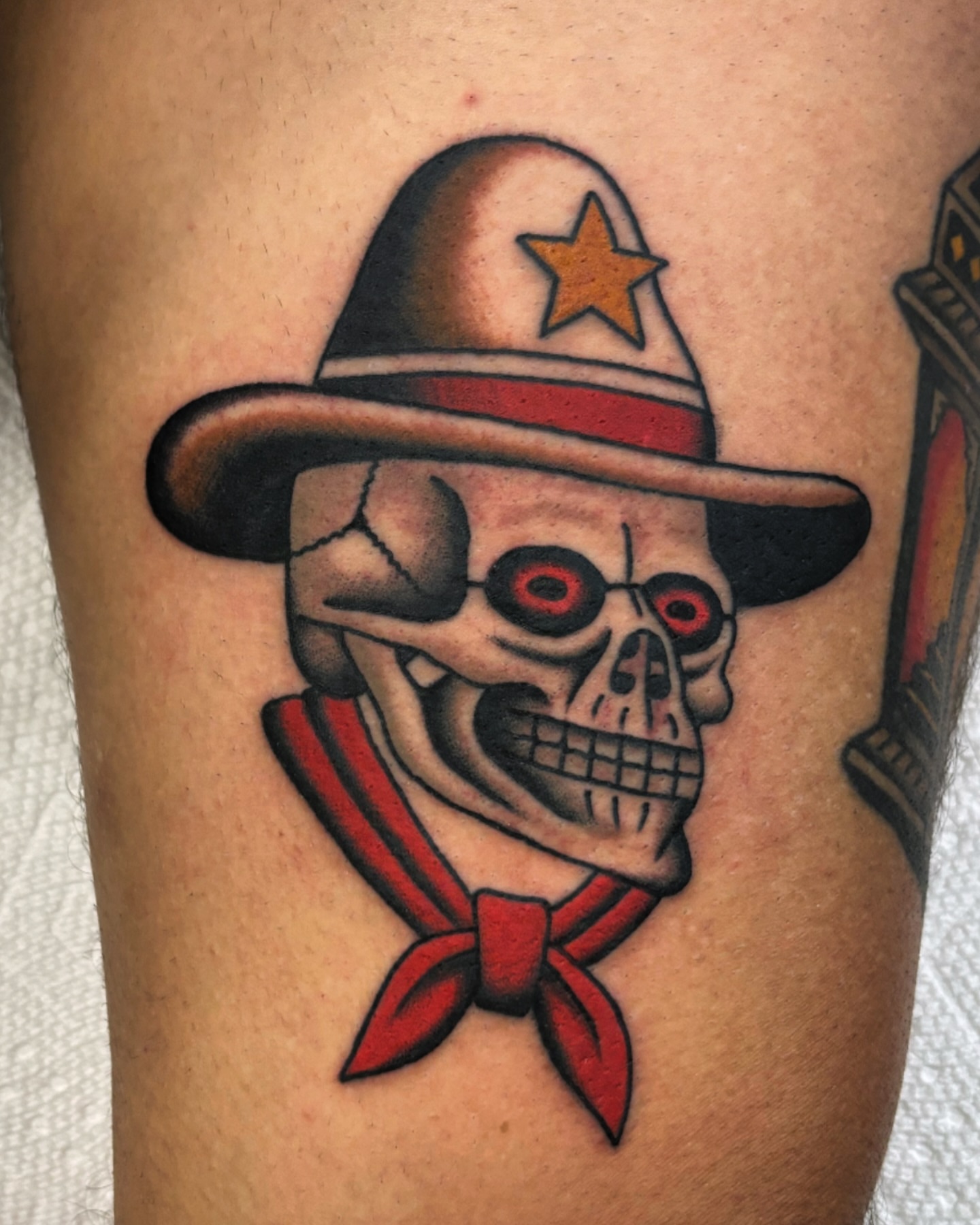 Skull wearing hat American traditional tattoo on the forearm by Ben Fiedler