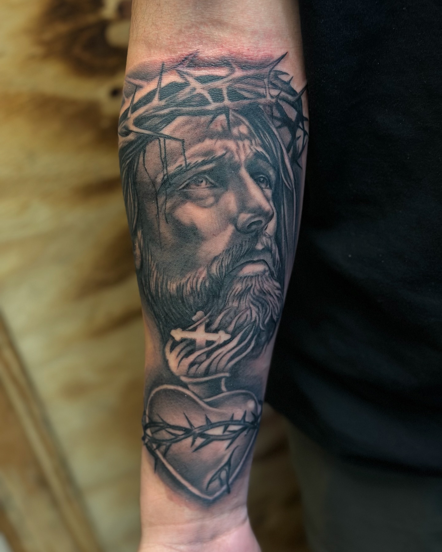 Religious figure realism tattoo on the forearm by Calvin Maryland 🇵🇹