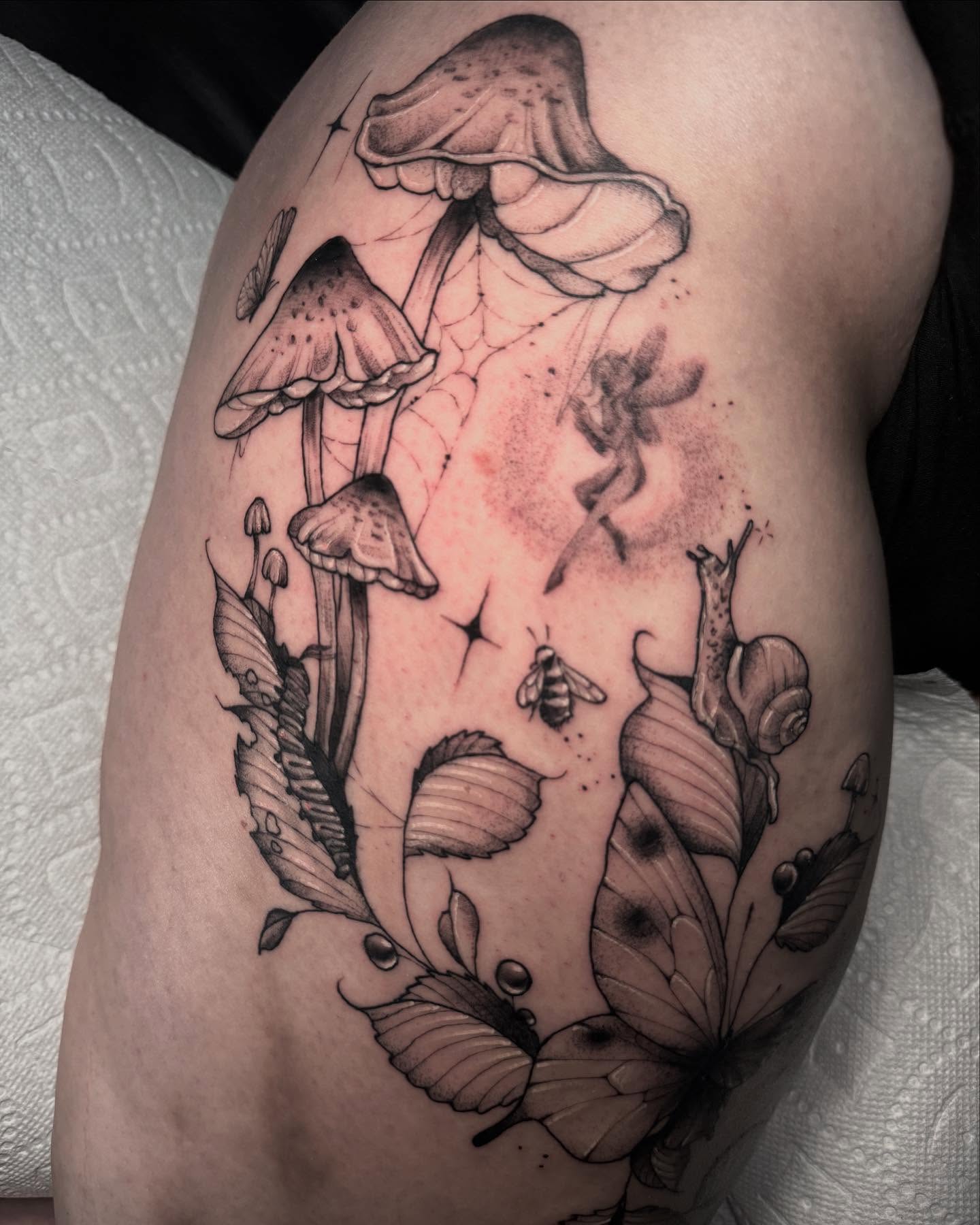 Mushroom and bee realism tattoo on the thigh by 𝔈𝔯𝔦𝔫 𝔊𝔦𝔩𝔩𝔦𝔩𝔞𝔫𝔡, Springfield, Ohio