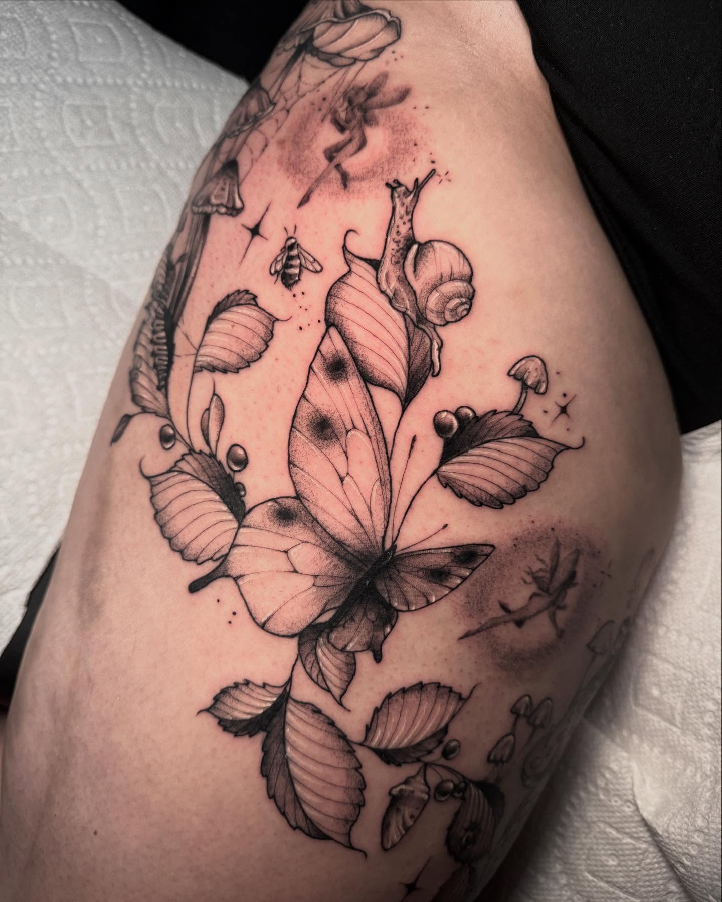 Butterfly and leaves dotwork tattoo on the thigh by 𝔈𝔯𝔦𝔫 𝔊𝔦𝔩𝔩𝔦𝔩𝔞𝔫𝔡, Springfield, Ohio