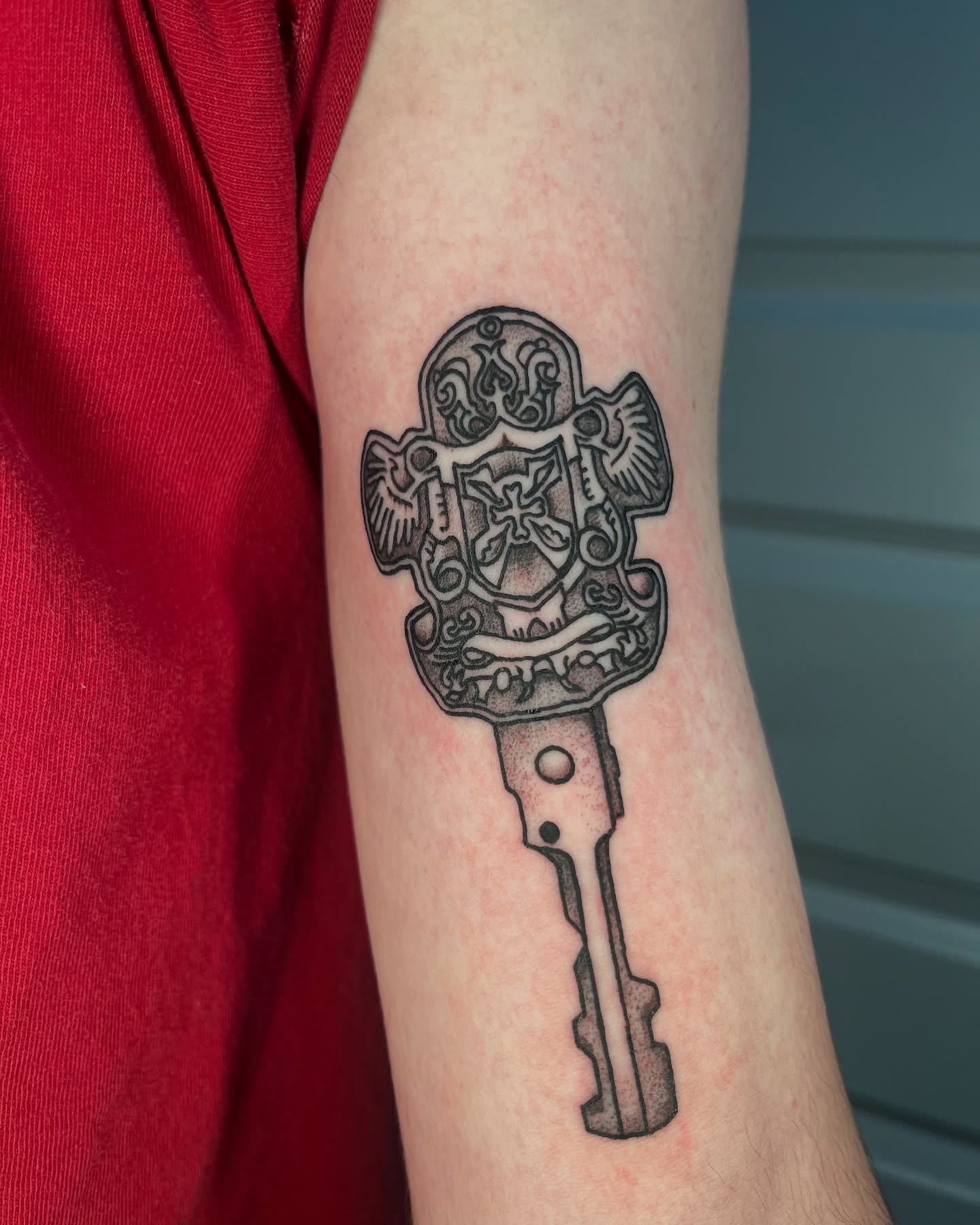 Key dotwork tattoo on the forearm by layne