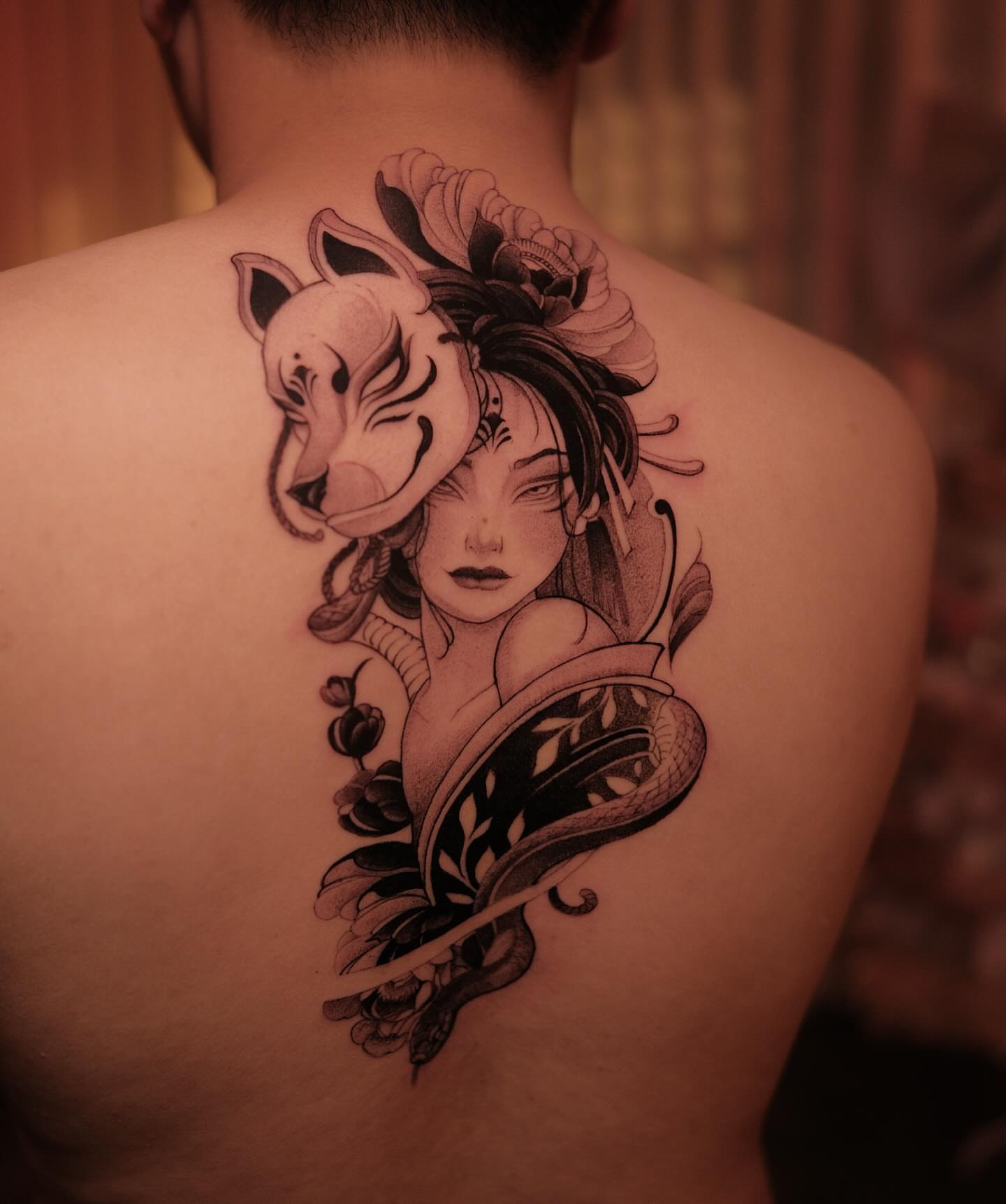 Woman with horse head realism tattoo on the back by Navei