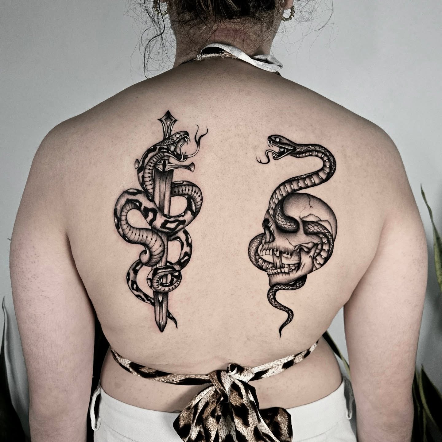 Snake and skull realism tattoo on the back by ✮ Monarch Tattoos ✮