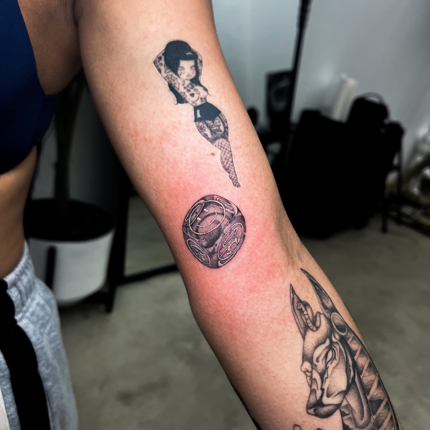 Mermaid and clock black and grey tattoo on the forearm by Priscila, Los Angeles, California
