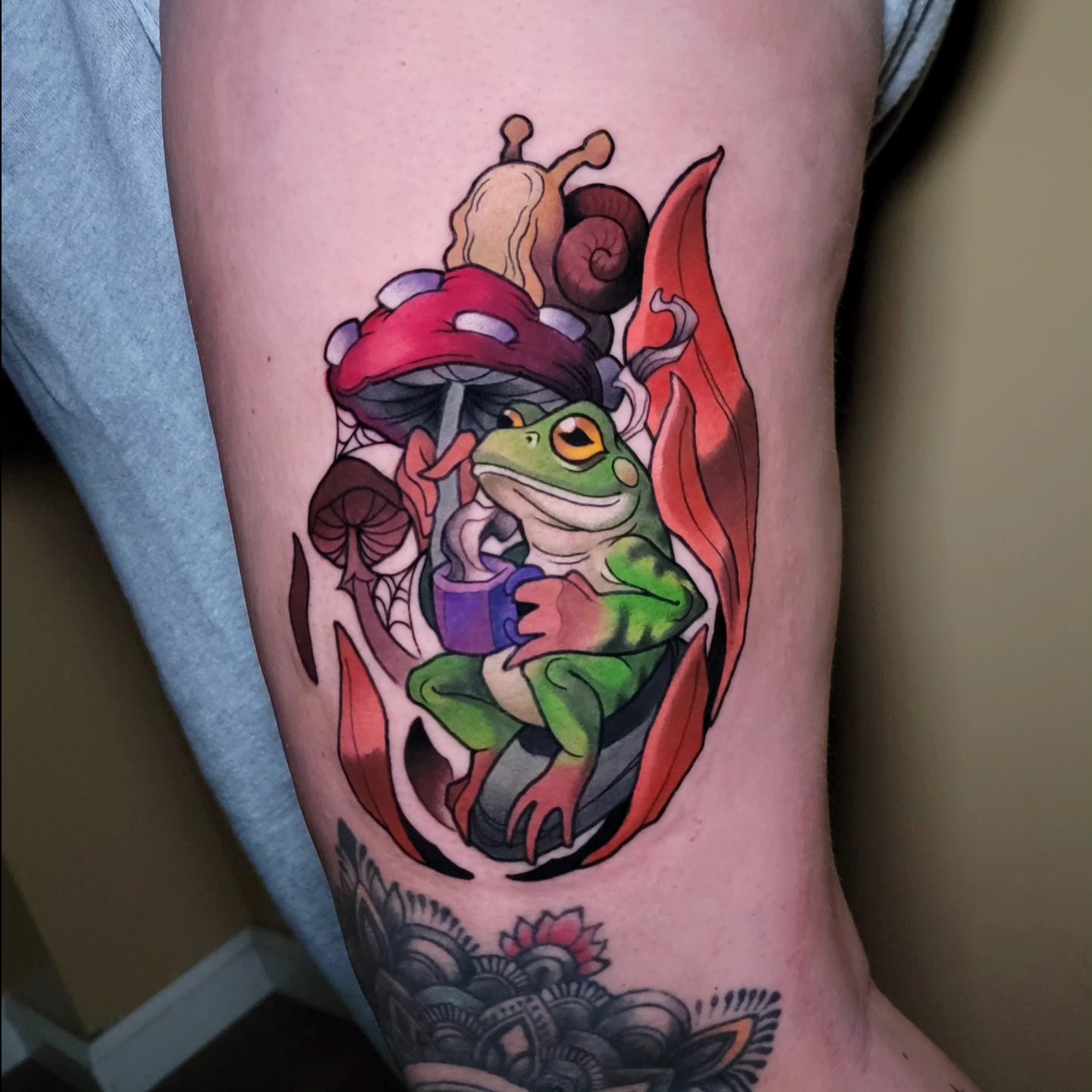 Frog with mushrooms and snail new school tattoo on the forearm by Anime and newschool tattoos in Harker
