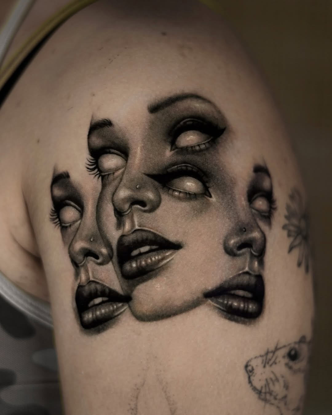 Multiple faces surrealism tattoo on the shoulder by hiba ⊹ atlanta tattoo artist, Johns Creek, Georgia