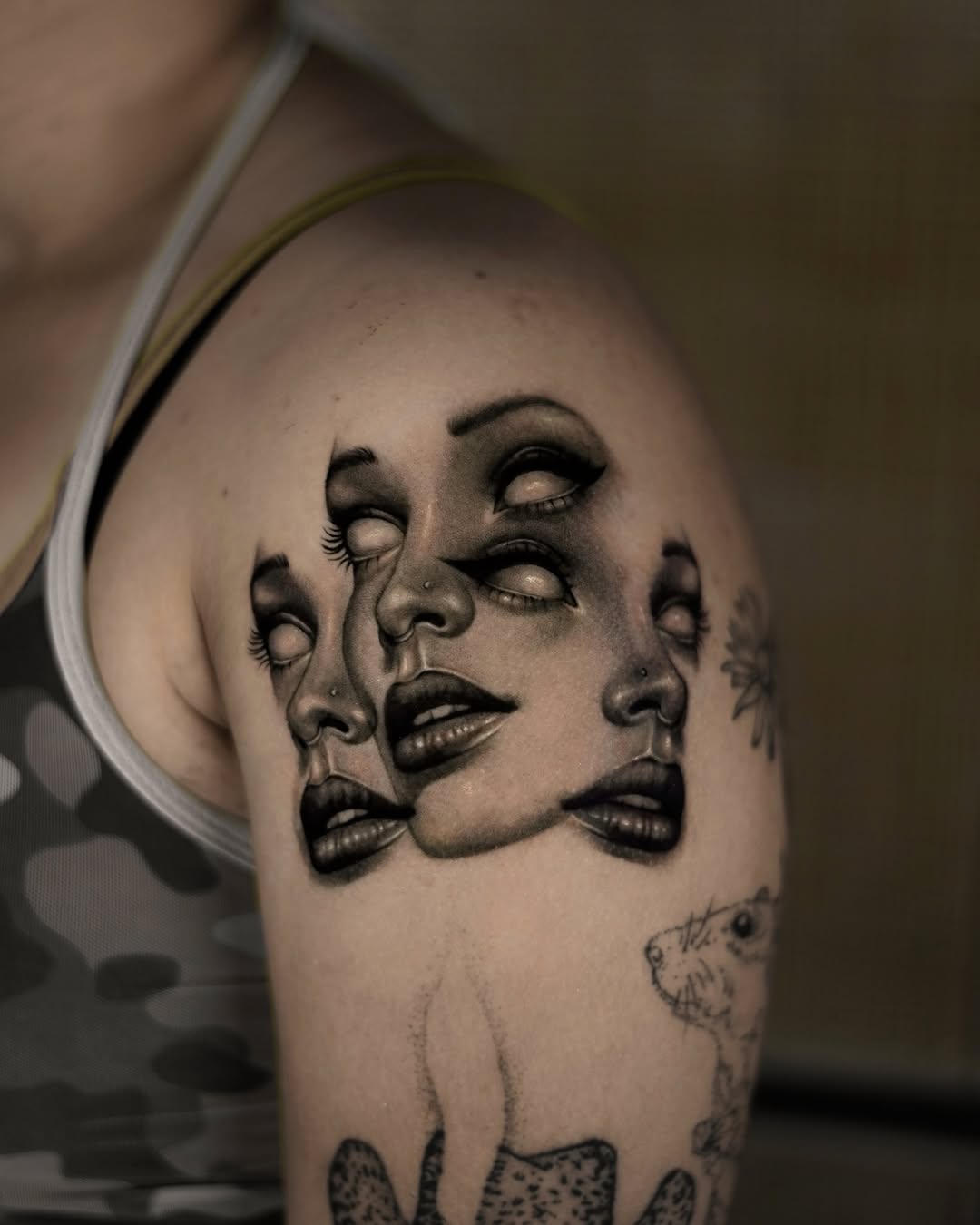 Surreal faces surrealism tattoo on the shoulder by hiba ⊹ atlanta tattoo artist, Johns Creek, Georgia