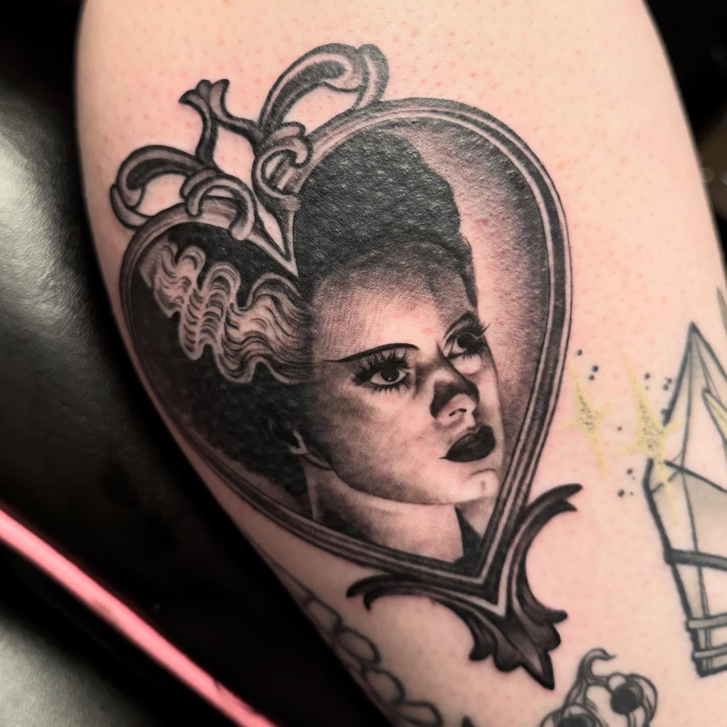 Portrait realism tattoo on the thigh by Shelby Raia