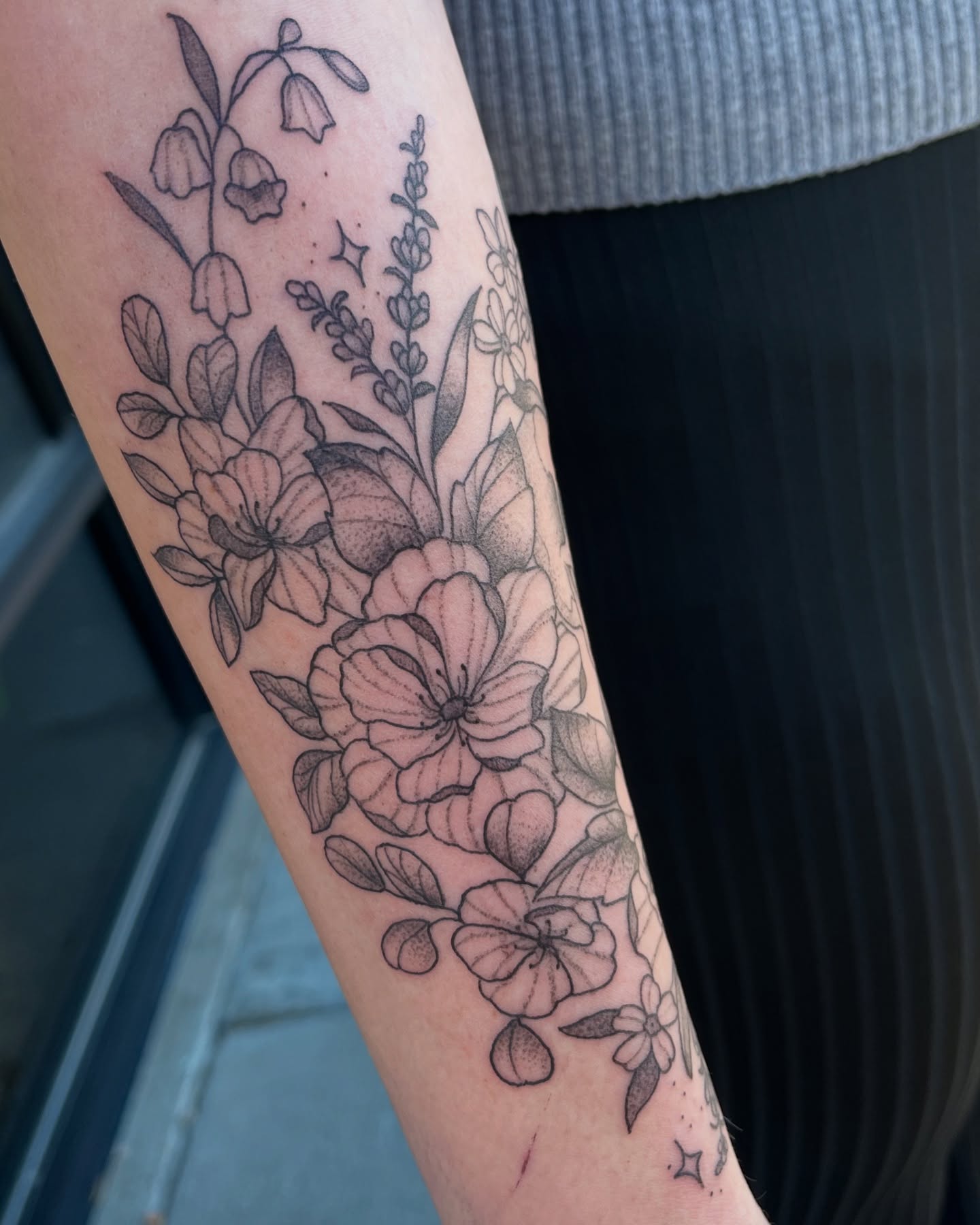Floral bouquet black and grey tattoo on the forearm by Tina Petrullo, West Chester Township, Butler County, Ohio