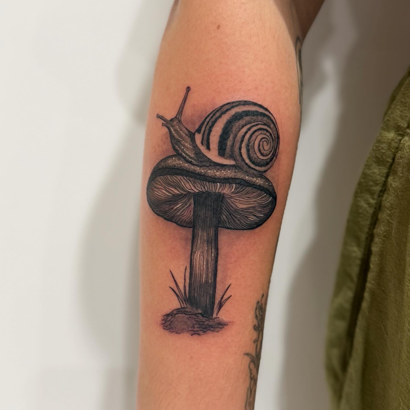 Snail on mushroom realism tattoo on the forearm by ⛓Ireland tattoo⛓