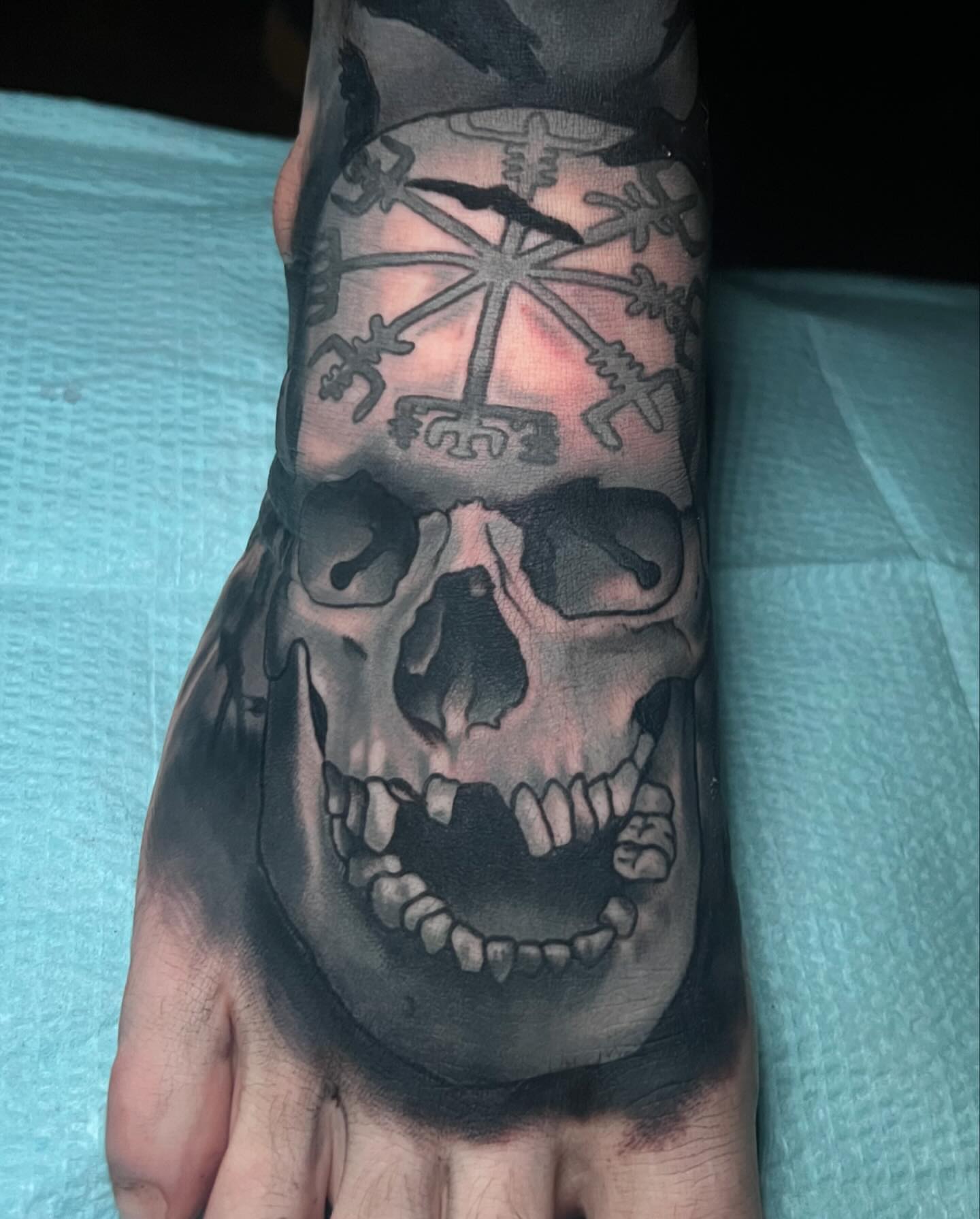 Skull realism tattoo on the forearm by Emily Walker