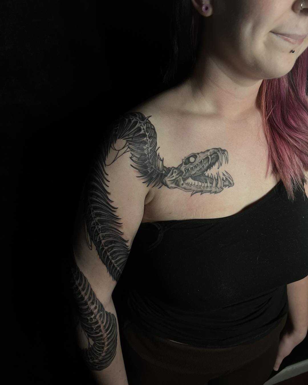 Snake black and grey tattoo on the shoulder by James Reed Tattoo artist