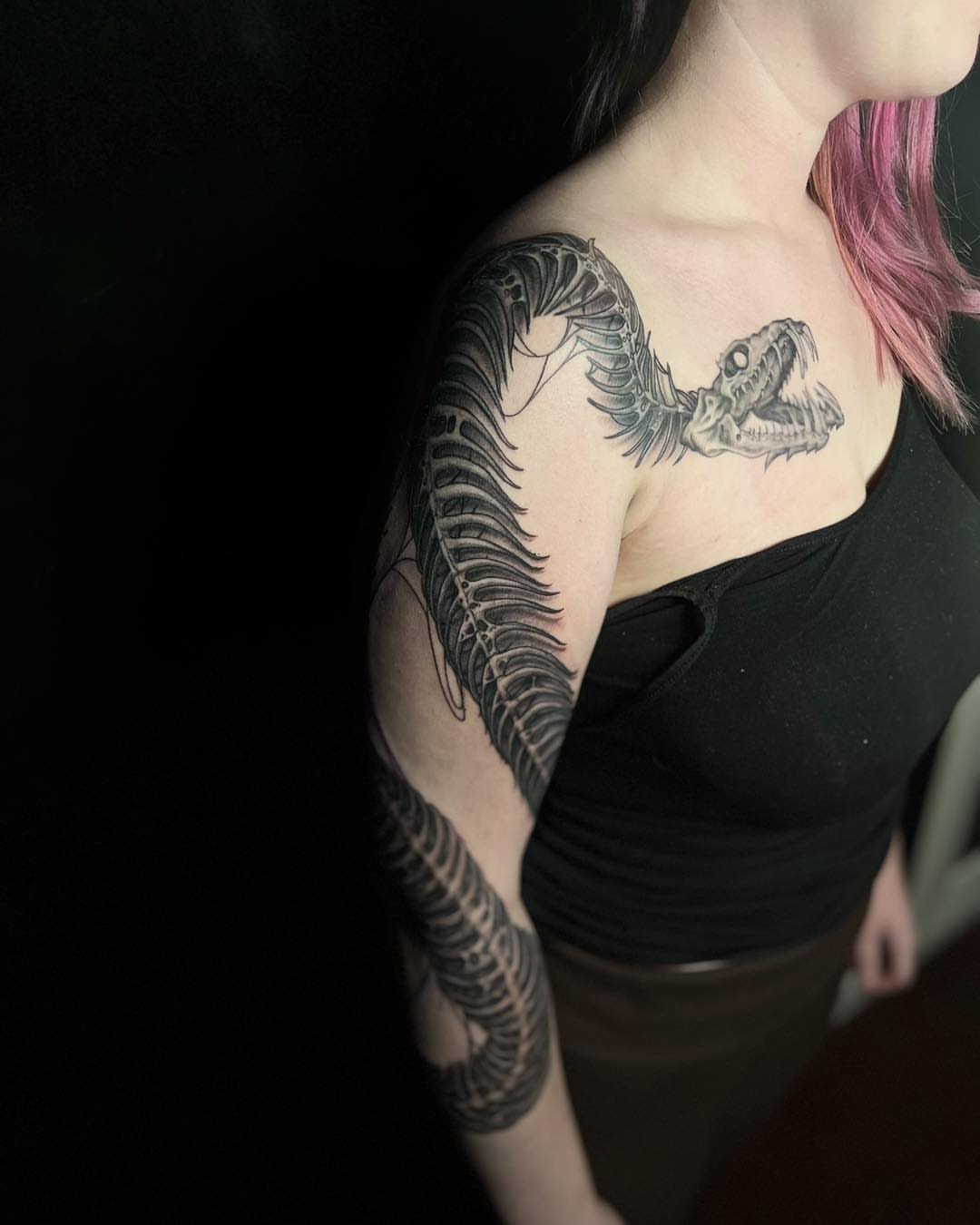 Snake realism tattoo on the upper arm by James Reed Tattoo artist
