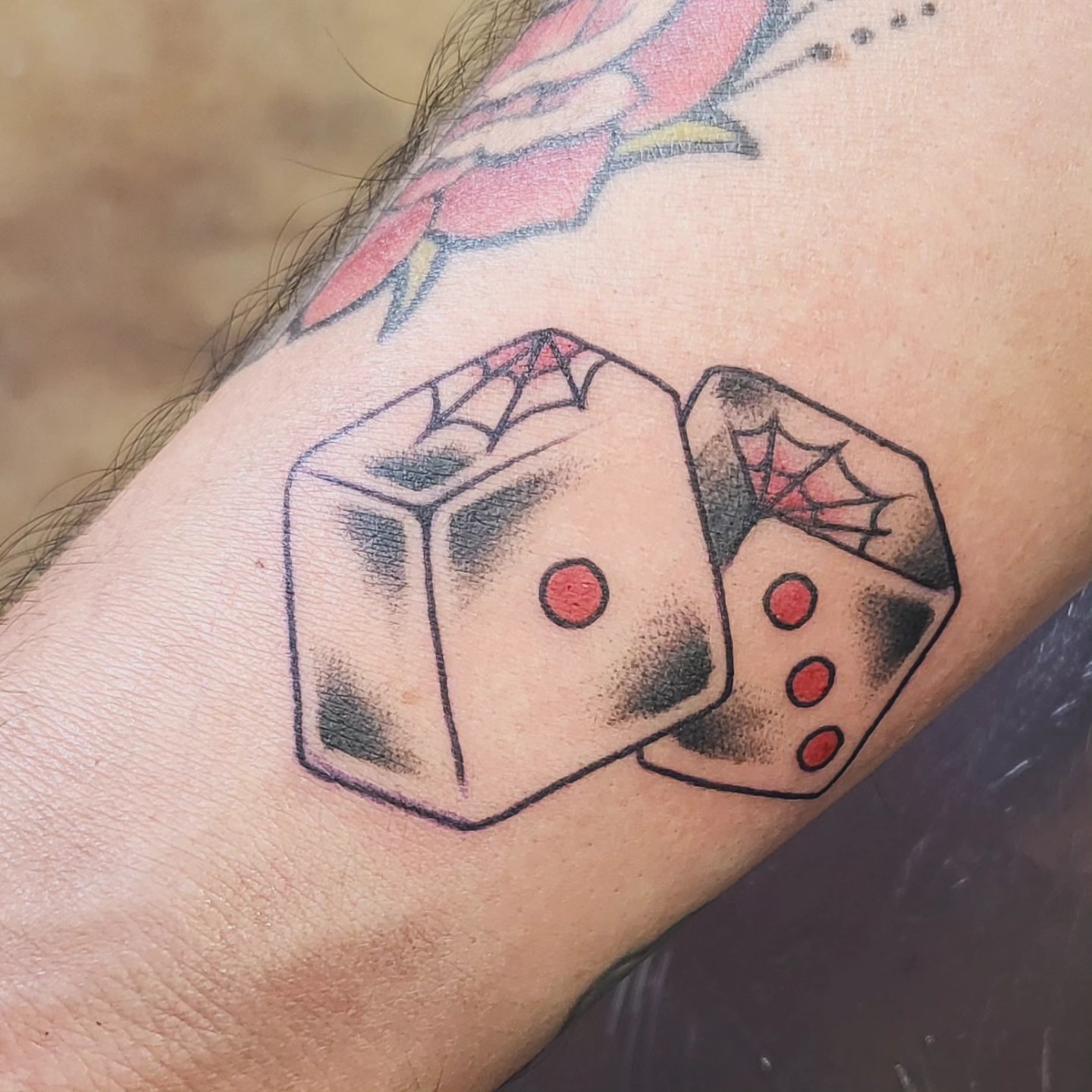 Dice American traditional tattoo on the forearm by Brenda Juarez - Tattoo Artist
