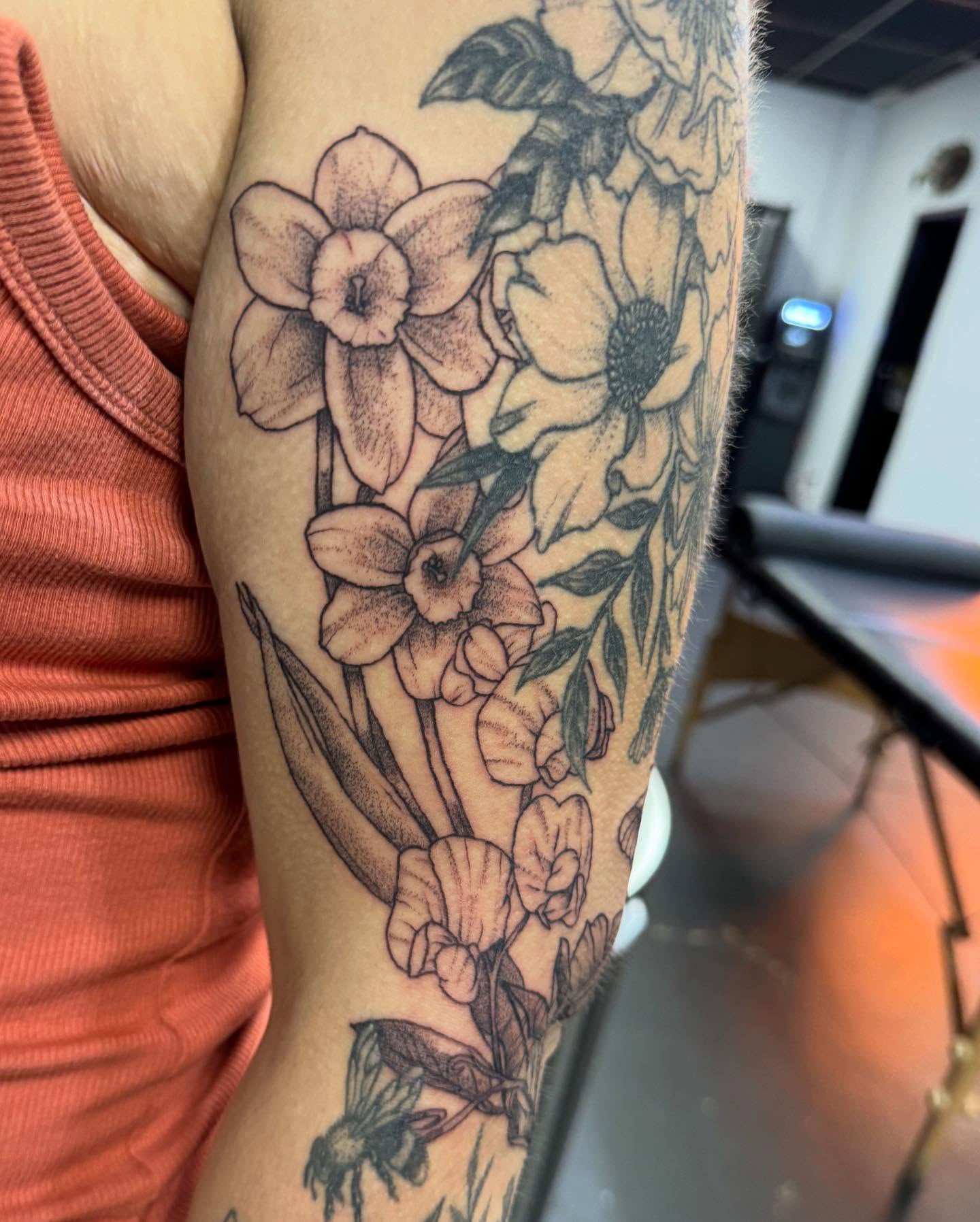 Floral bouquet black and grey tattoo on the forearm by Marissa Losier