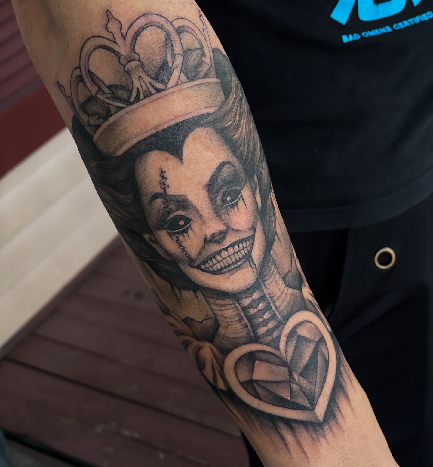 Clown queen realism tattoo on the forearm by Erica Olivier