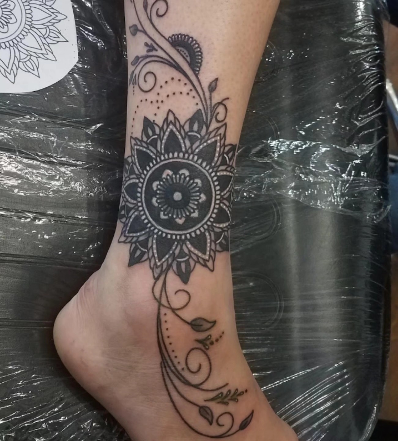Mandala dotwork tattoo on the foot by Tivis Phillips