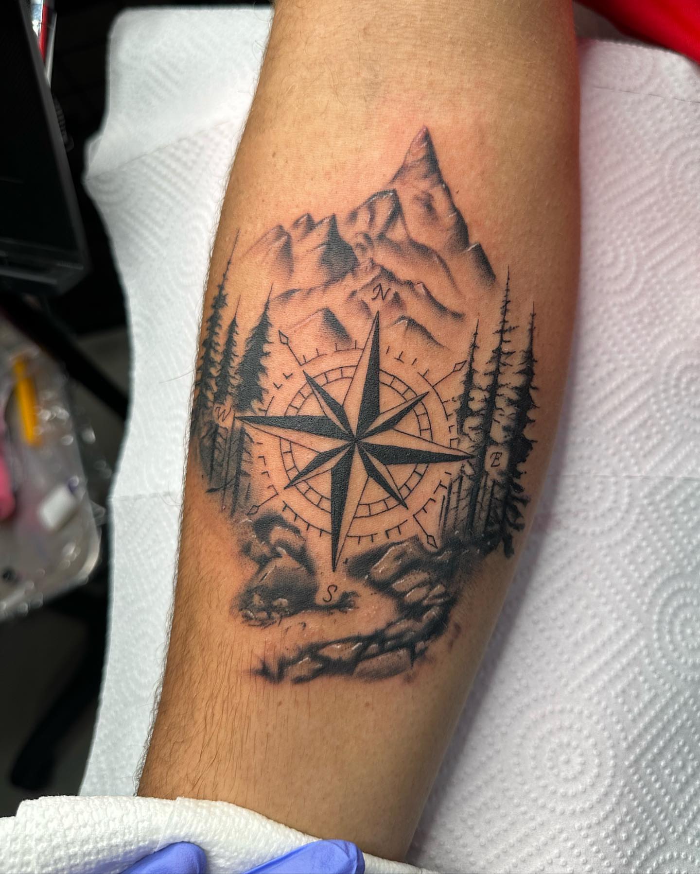 Compass and mountain landscape realism tattoo on the forearm by ⭒ ʜᴀɪʟᴇʏ ᴍᴇᴛᴢ ⭒