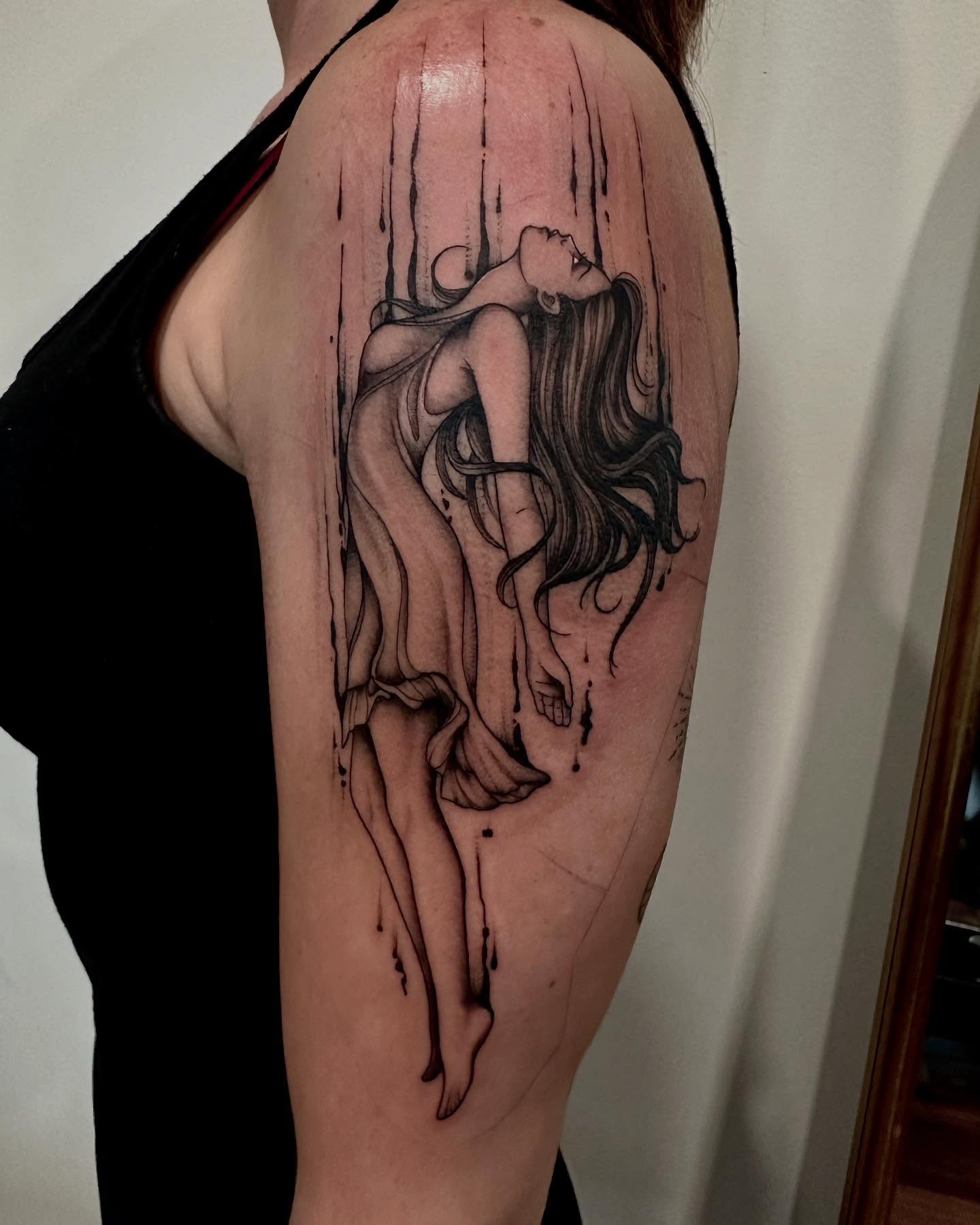 Woman realism tattoo on the shoulder by Kate Darling