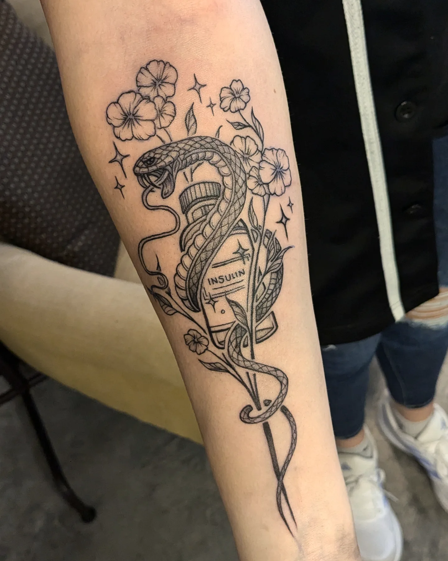 Snake and flowers black and grey tattoo on the forearm by ⁘ heléna tupou-lisle ⁘