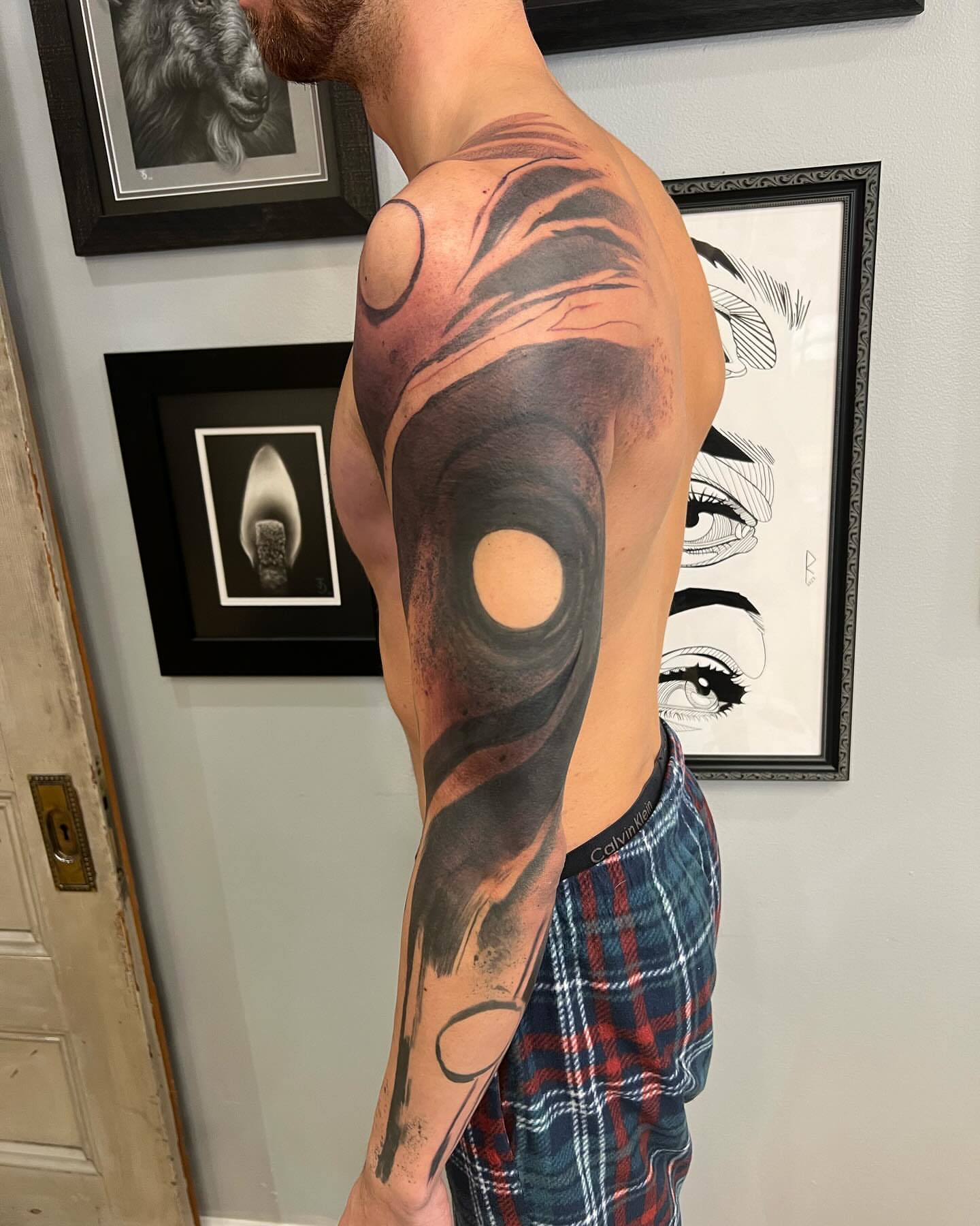 Abstract swirl realism tattoo on the upper arm by Rizzie D'Alterio