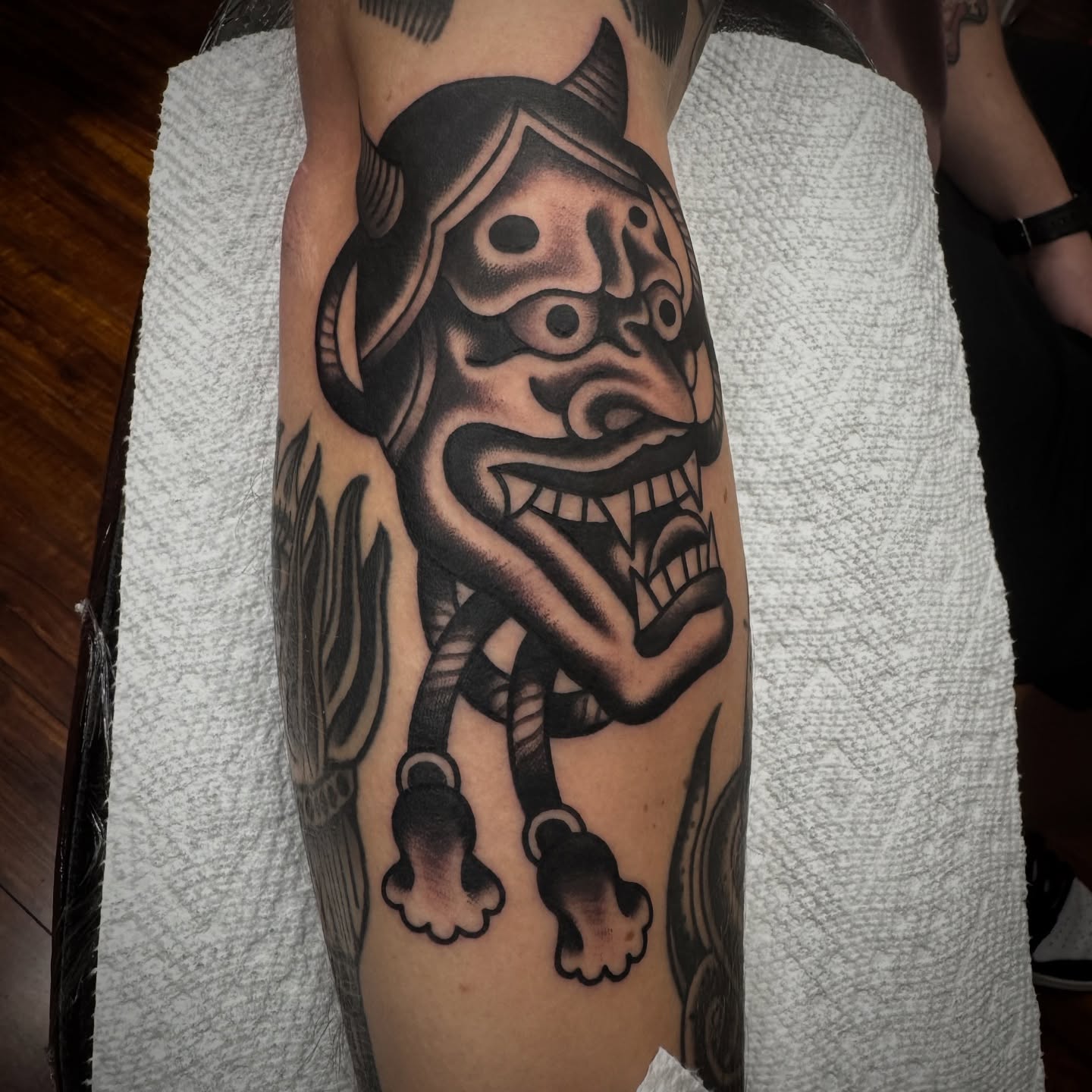 Demon American traditional tattoo on the forearm by Rogelio Robles