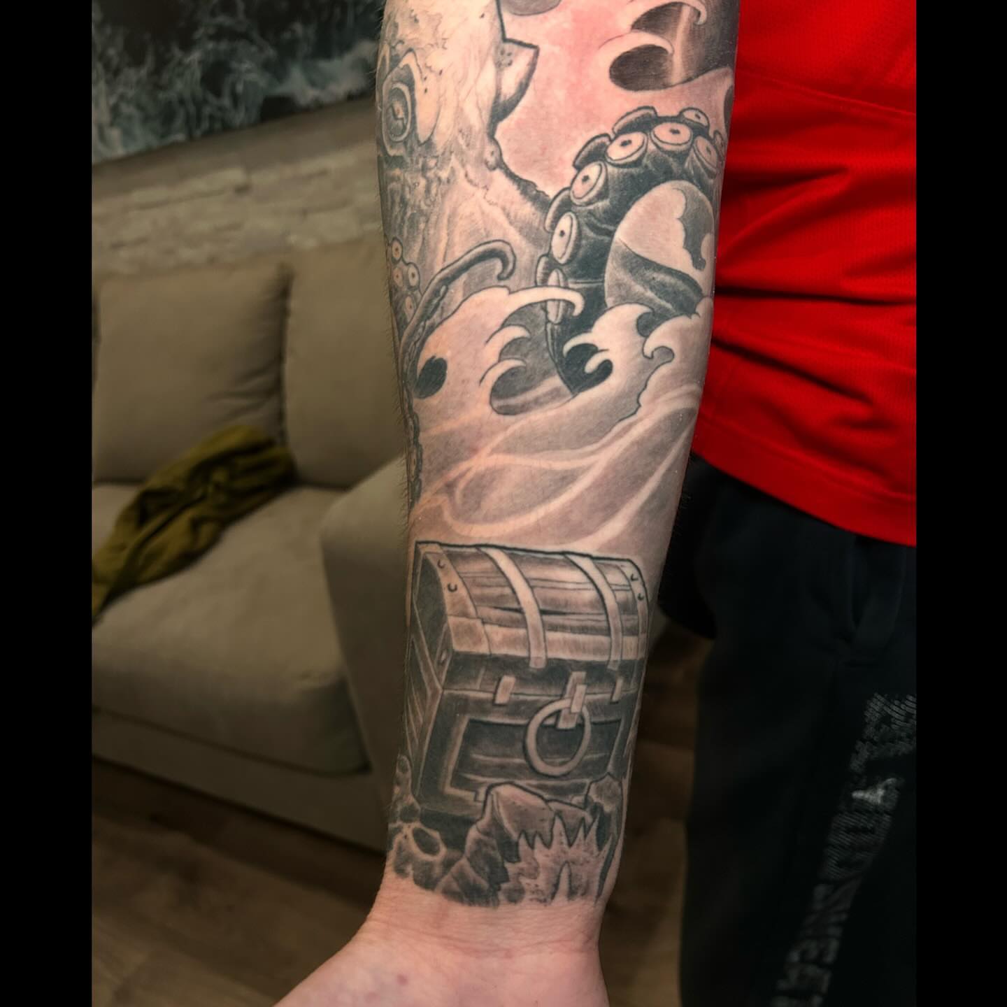 Pirate ship and octopus realism tattoo on the forearm by Marvin Silva