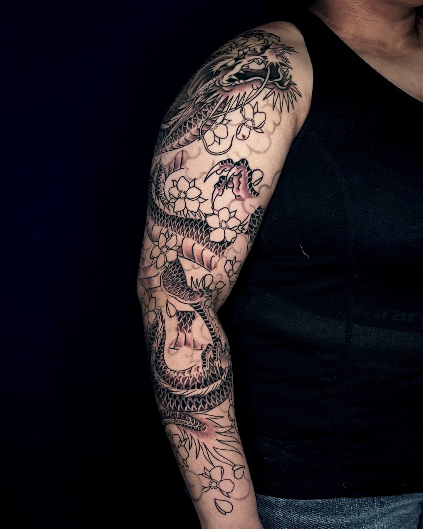 Dragon and flowers japanese irezumi tattoo on the forearm by Matt Trimble, Charlotte, North Carolina
