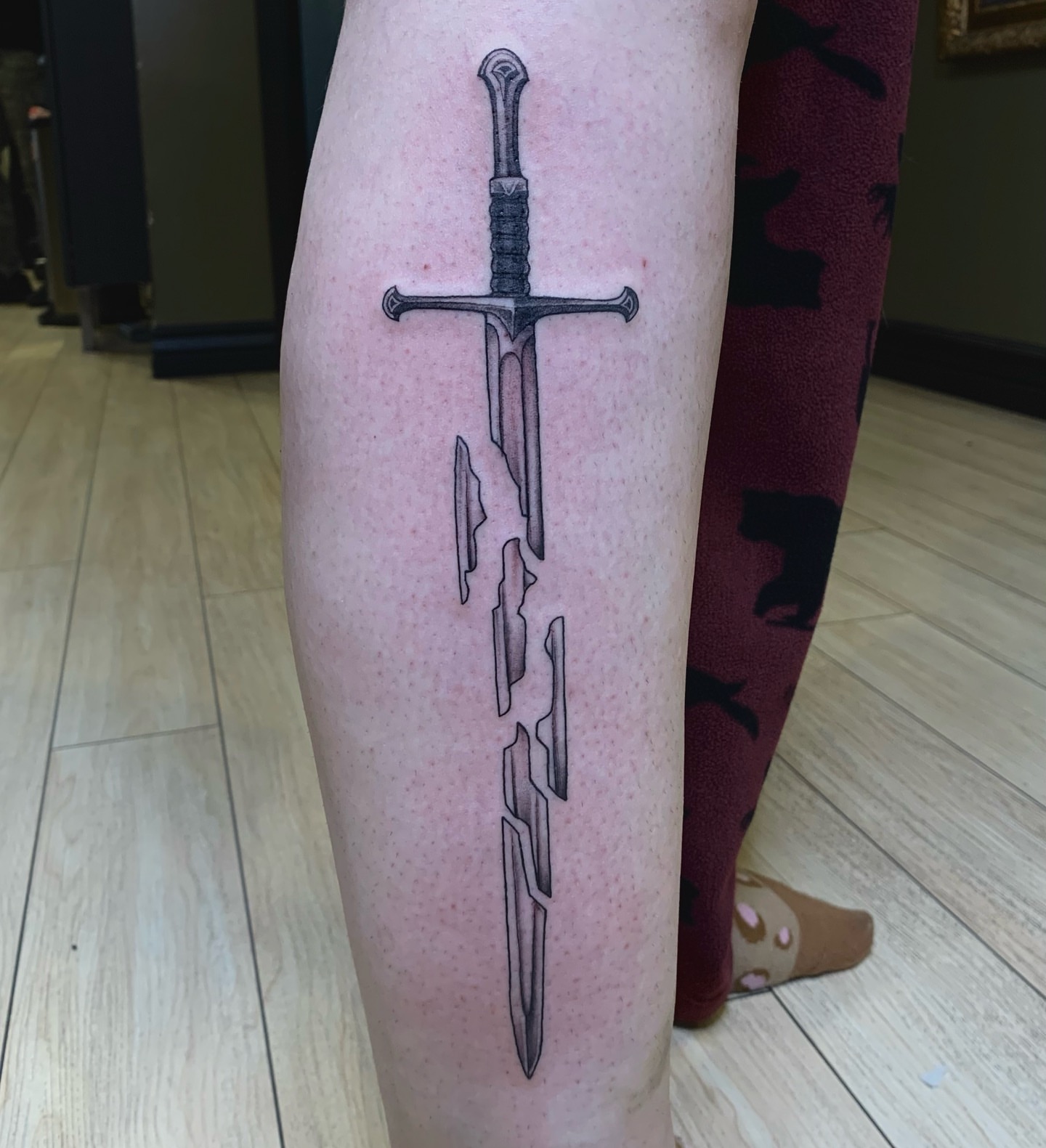 Sword black and grey tattoo on the forearm by Tad Fulkerson, San Francisco, California