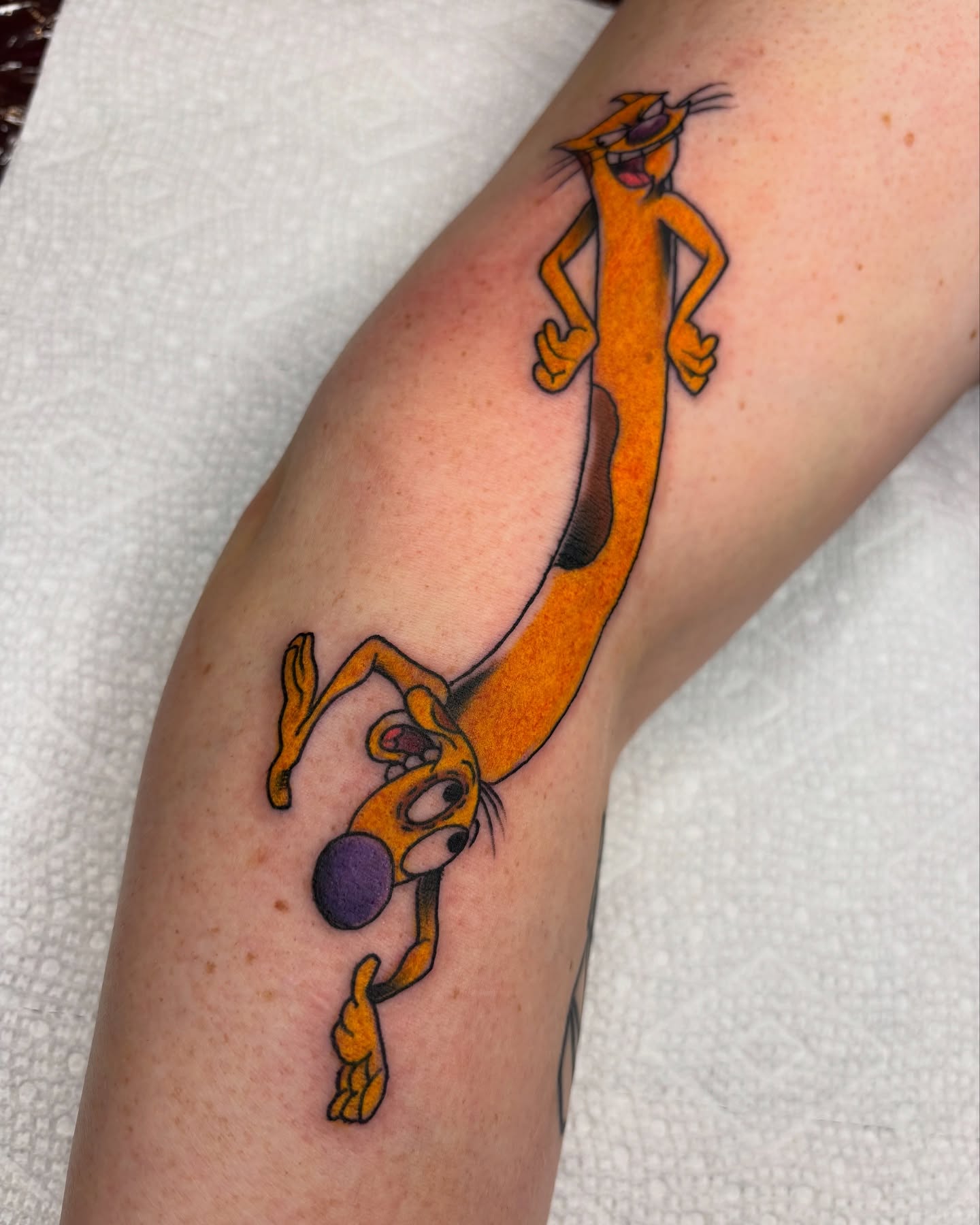 Cat chasing ball realism tattoo on the forearm by Blake Alan Tattoos (TROUT)